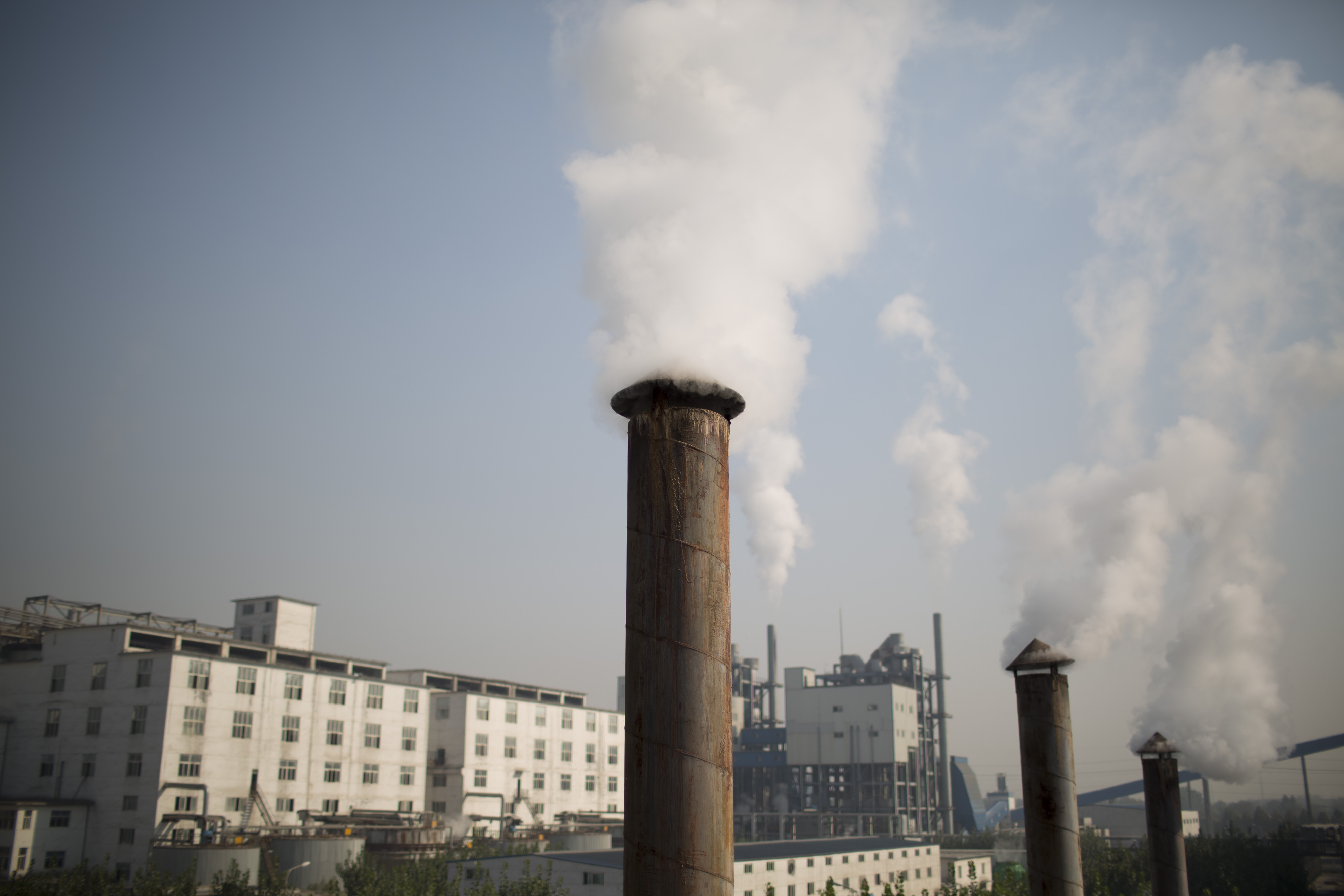 Profit growth at listed Chinese firms has slowed in the first three months of 2014. Photo: Bloomberg Profit growth at listed Chinese firms has slowed in the first three months of 2014. Photo: Bloomberg