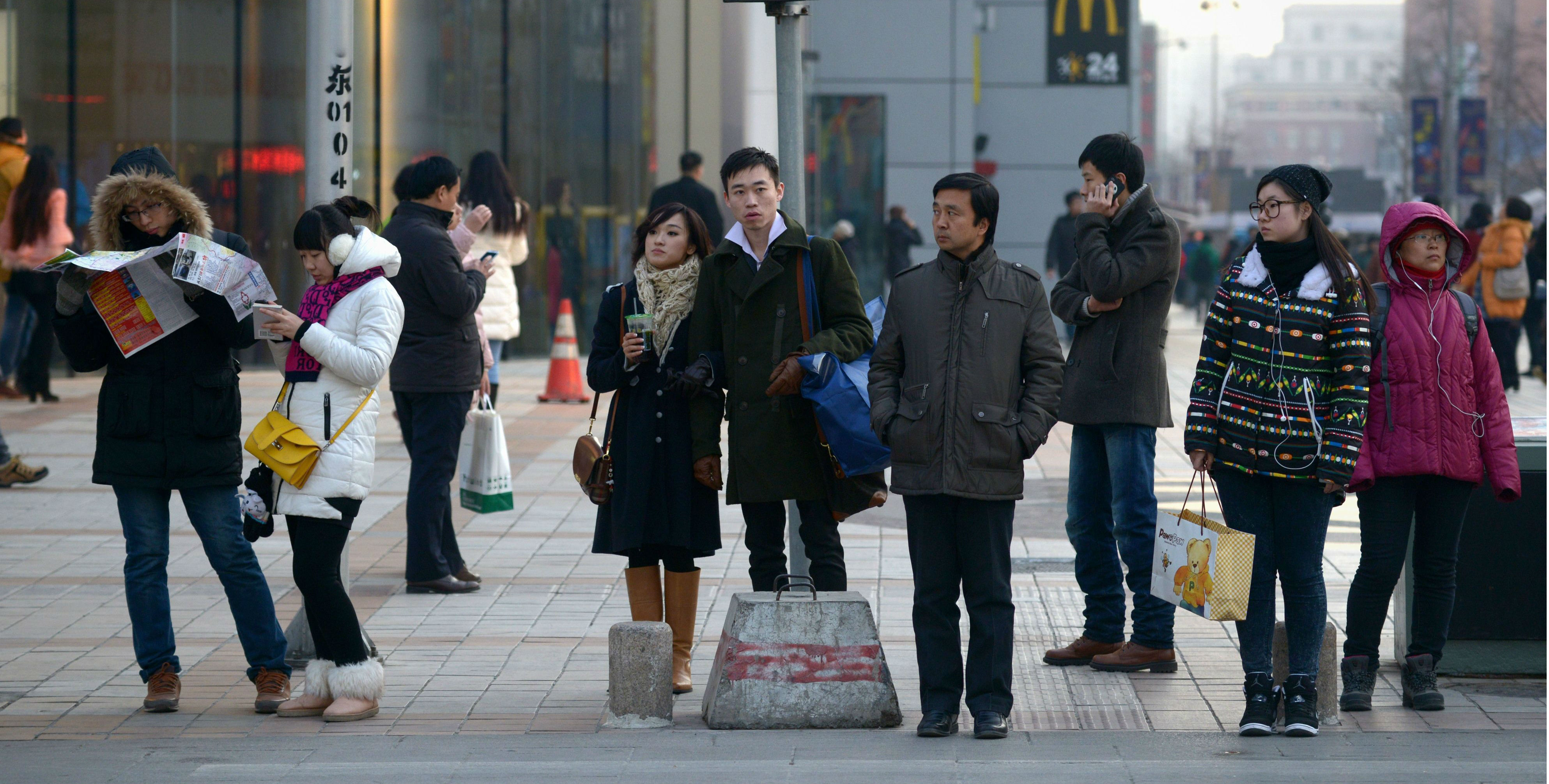 The new policy will require China's nearly 40 million public sector employees to make contributions to the pension fund. Photo: AFP The new policy will require China's nearly 40 million public sector employees to make contributions to the pension fund. Photo: AFP