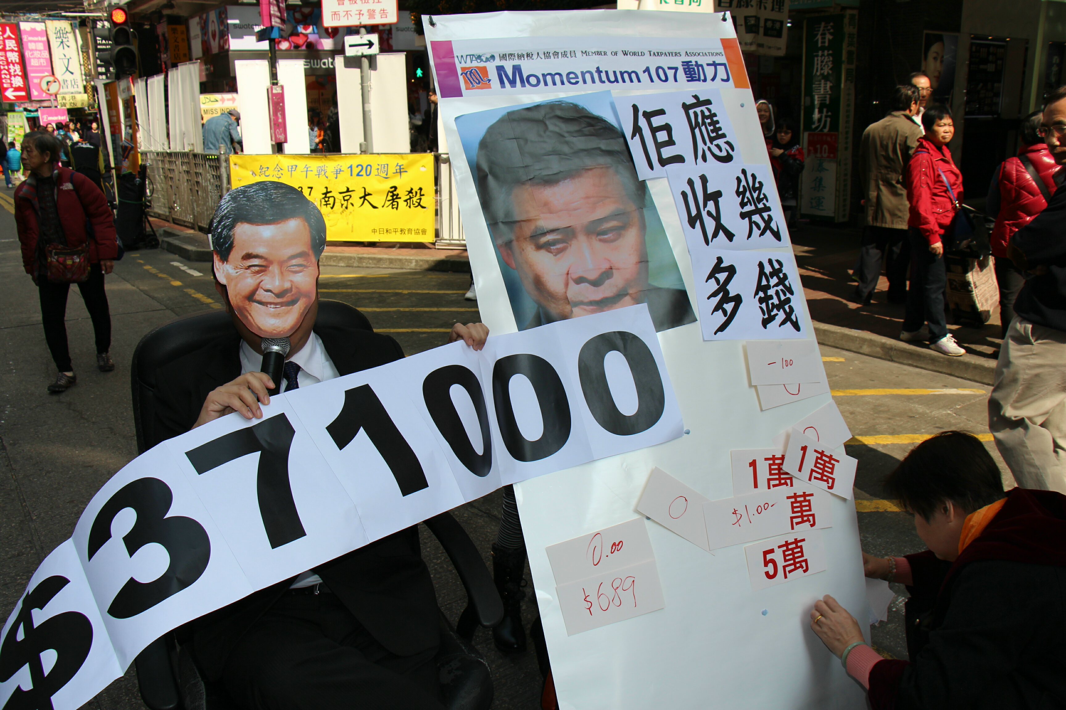 Activists are questioning Chief Executive CY Leung's decision to grant himself and his cabinet ministers higher pay from next month. Photo: Momentum 10 Activists are questioning Chief Executive CY Leung's decision to grant himself and his cabinet ministers higher pay from next month. Photo: Momentum 10