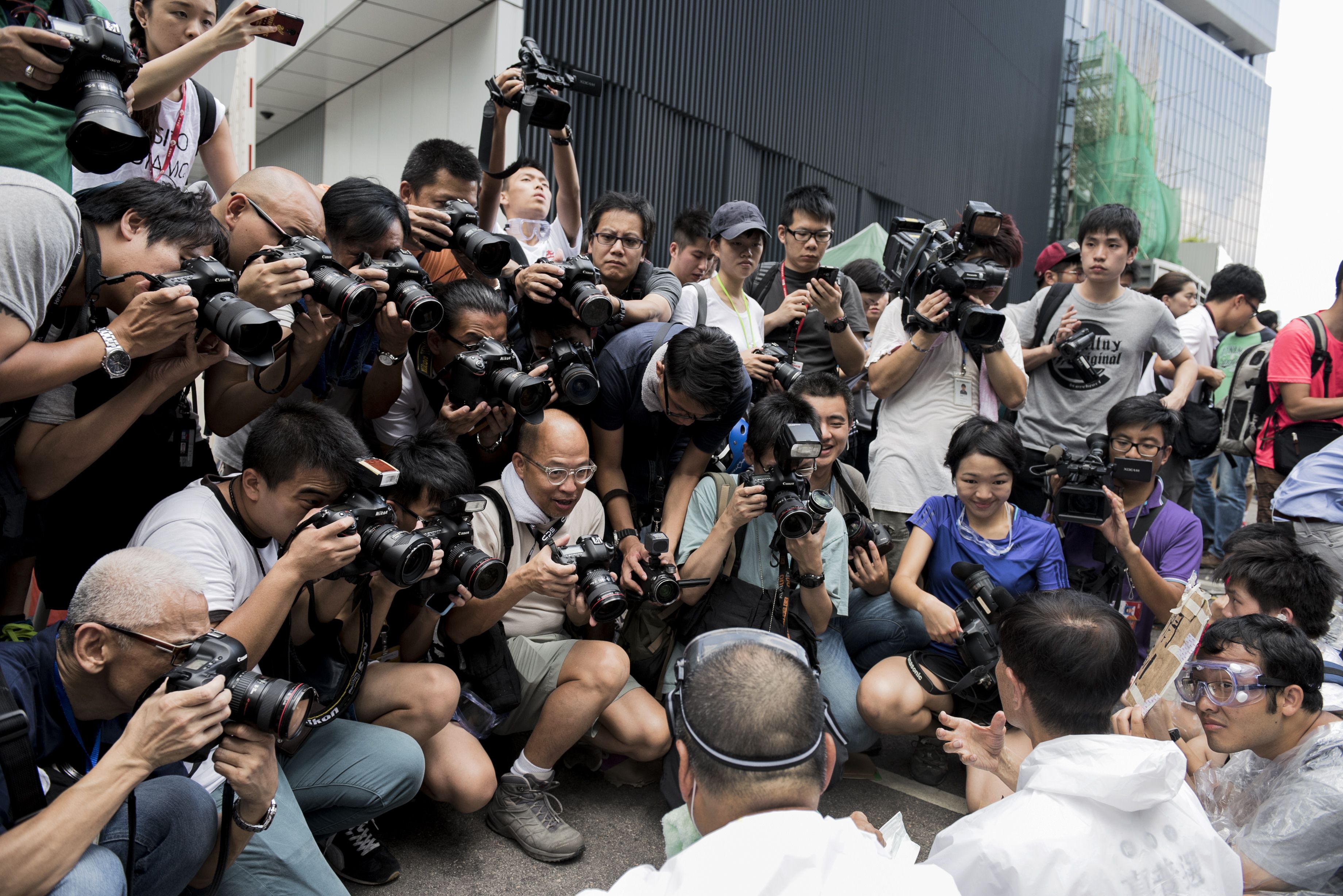 There were at least 39 recorded cases in which reporters were harassed, beaten, detained or maliciously accused either by the Hong Kong police or by anti-Occupy people, according to IFJ. Photo: AFP There were at least 39 recorded cases in which reporters were harassed, beaten, detained or maliciously accused either by the Hong Kong police or by anti-Occupy people, according to IFJ. Photo: AFP