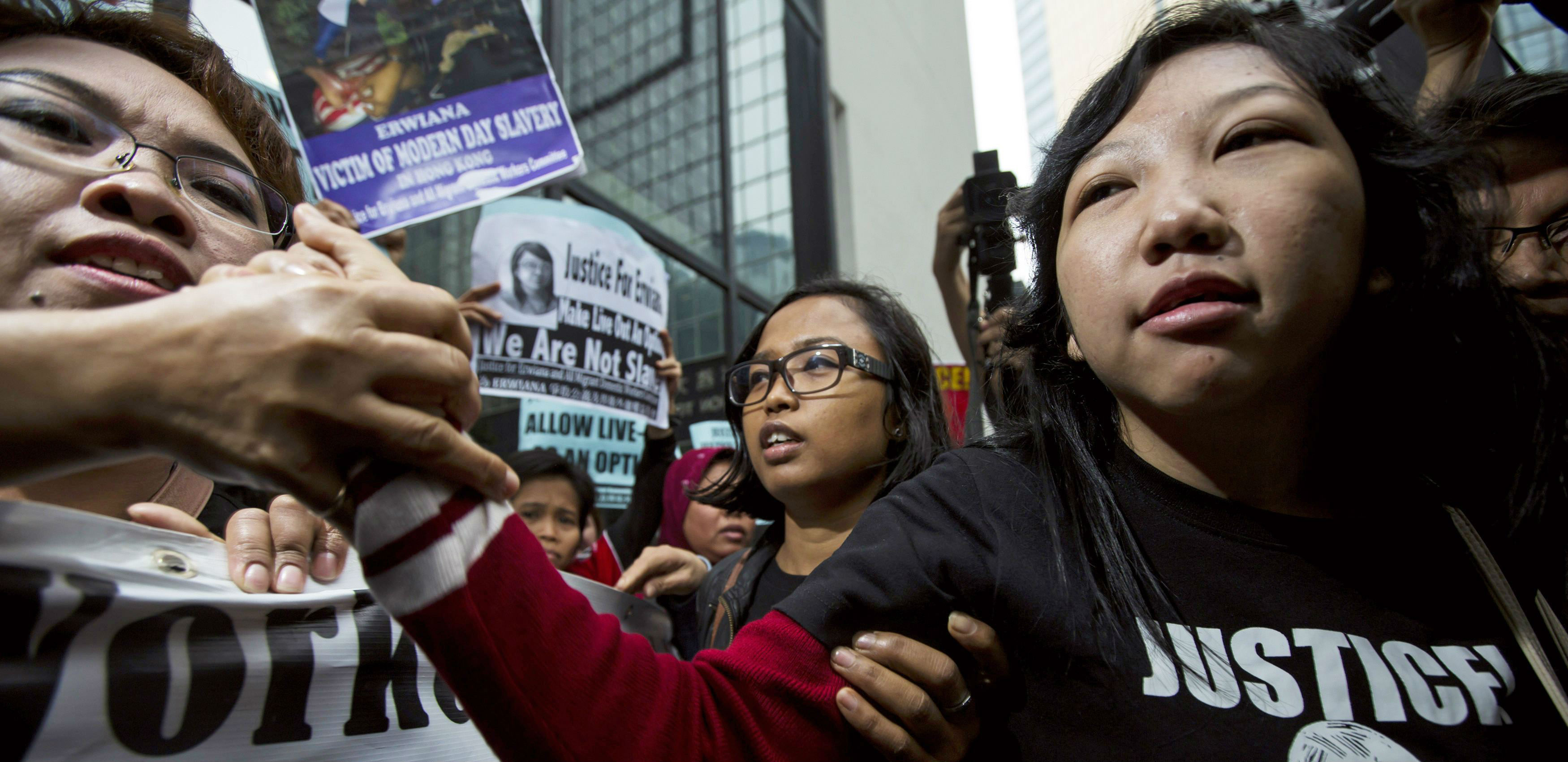 Former Indonesian maid Erwiana Sulistyaningsih is greeted by supporters outside the district court on Friday. Photo: Reuters Former Indonesian maid Erwiana Sulistyaningsih is greeted by supporters outside the district court on Friday. Photo: Reuters