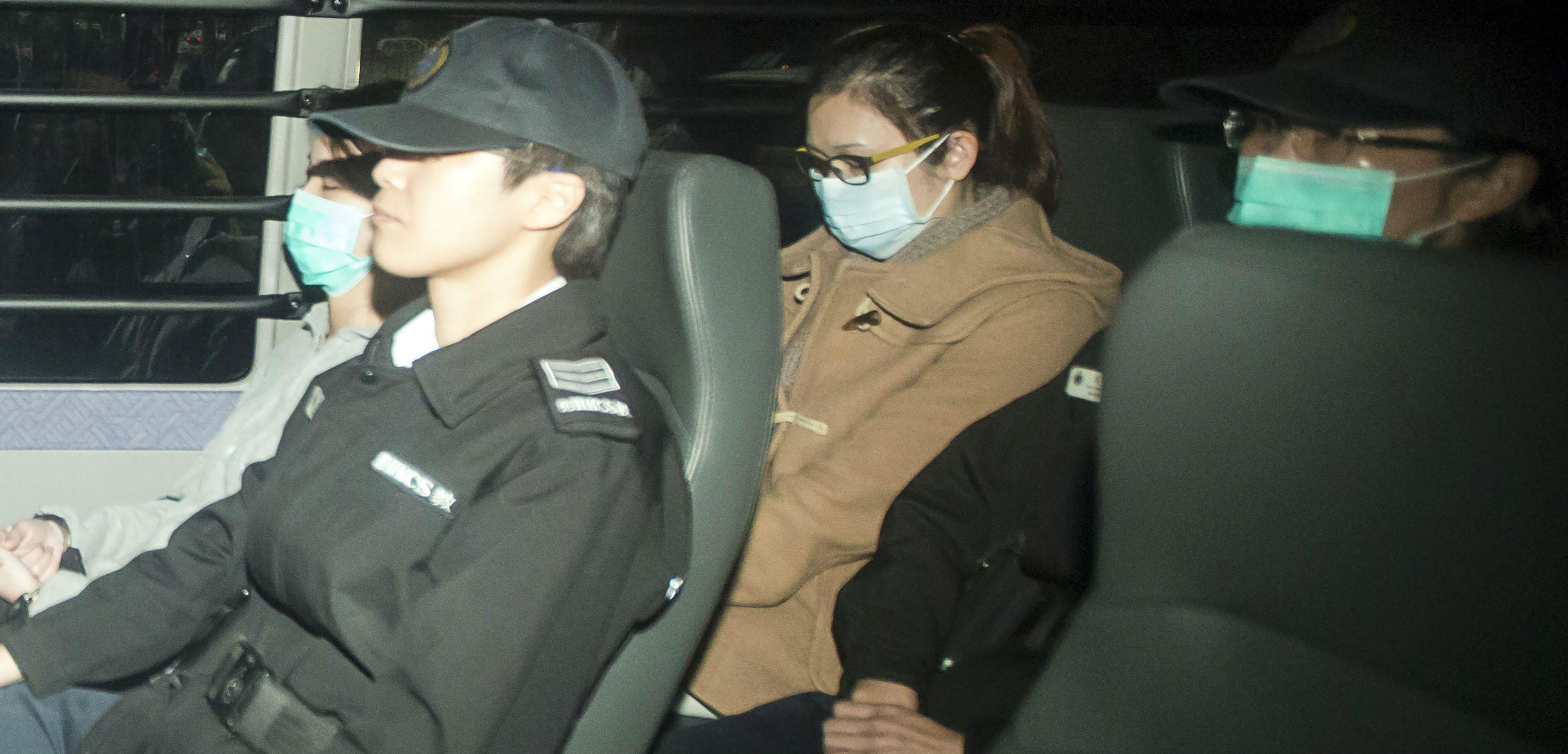 Law Wan-tung (center) arrives at the district court aboard a prison van on Friday. Photo: Reuters Law Wan-tung (center) arrives at the district court aboard a prison van on Friday. Photo: Reuters
