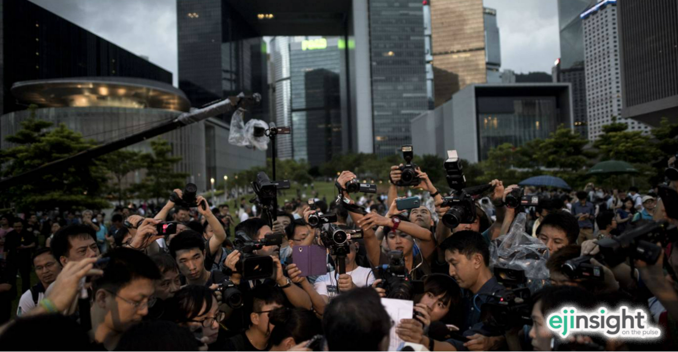 A media scrum typifies the pre-occupation of Hong Kong's mass media with the news. Beijing is trying co-opt media outlets to advance its agenda in Hong Kong. Photo: AFP A media scrum typifies the pre-occupation of Hong Kong's mass media with the news. Beijing is trying co-opt media outlets to advance its agenda in Hong Kong. Photo: AFP