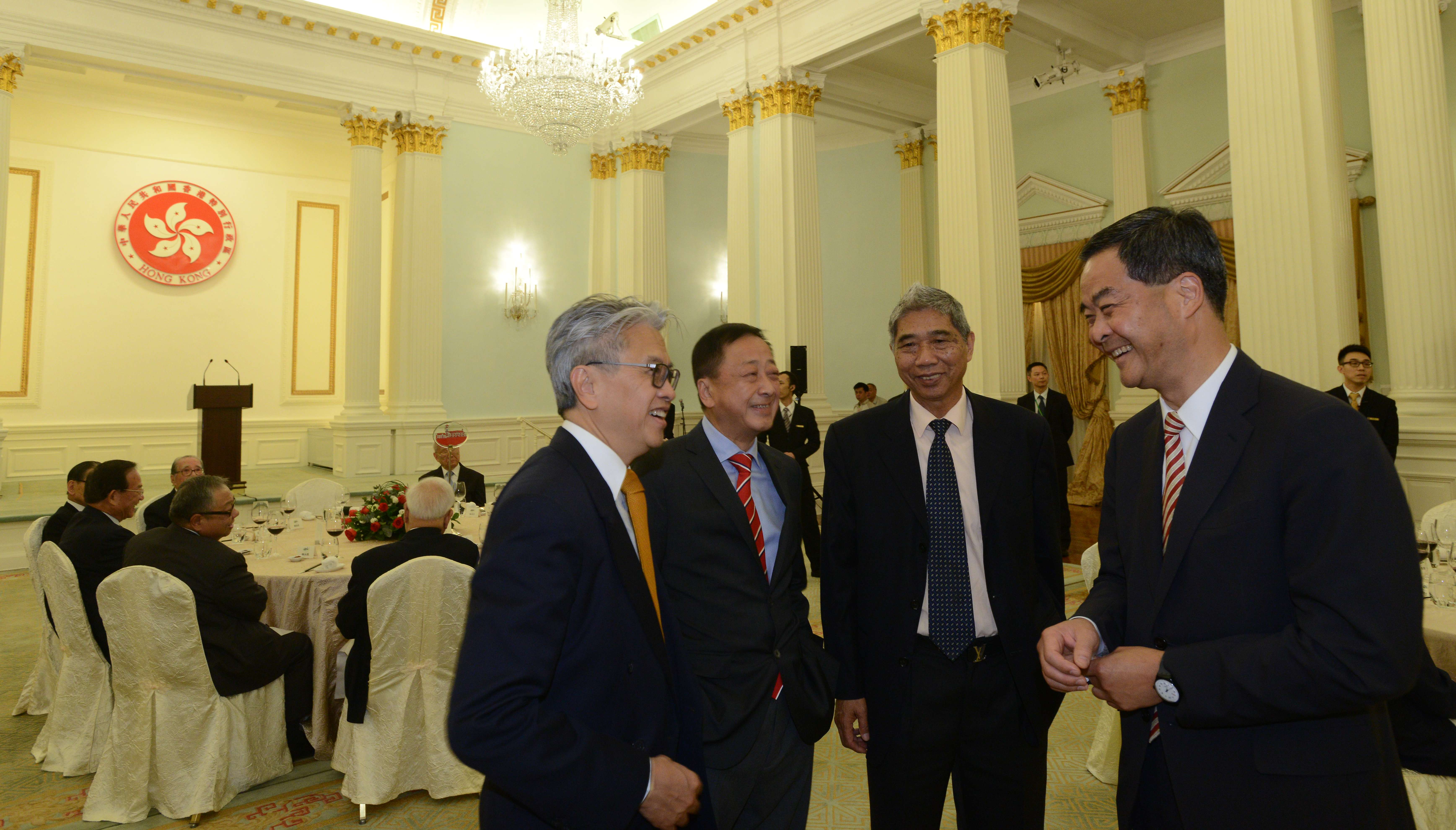 Leung Chun-ying (right), seen greeting guests at a Basic Law reception dinner, has been making outrageous claims about governance systems. Photo: GIS Leung Chun-ying (right), seen greeting guests at a Basic Law reception dinner, has been making outrageous claims about governance systems. Photo: GIS