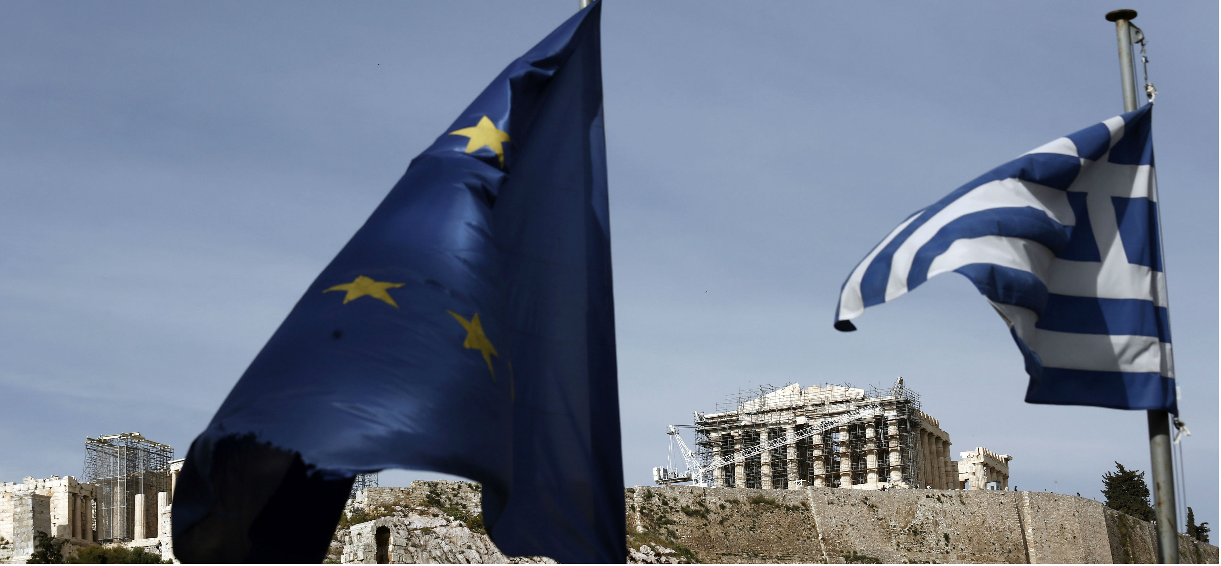 The European Union and Greek flags fly beneath the Parthenon in Athens. Austerity alone would not suffice for a country to cut its debt. Photo: Bloomberg The European Union and Greek flags fly beneath the Parthenon in Athens. Austerity alone would not suffice for a country to cut its debt. Photo: Bloomberg