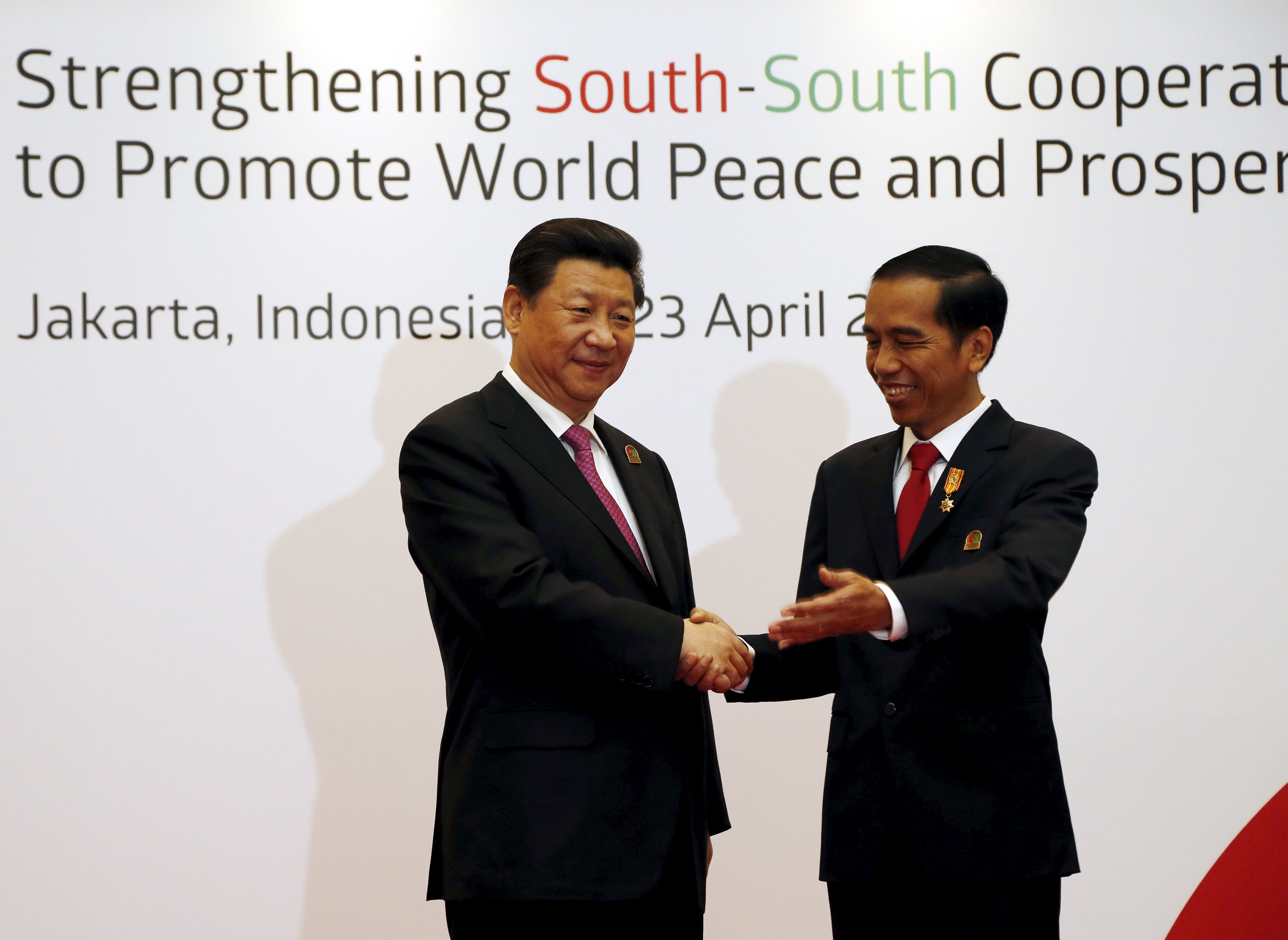 Indonesian President Joko Widodo (R) greets his Chinese counterpart Xi Jinping at the opening ceremony of the Asian African Conference in Jakarta on Wednesday. Photo: Reuters Indonesian President Joko Widodo (R) greets his Chinese counterpart Xi Jinping at the opening ceremony of the Asian African Conference in Jakarta on Wednesday. Photo: Reuters