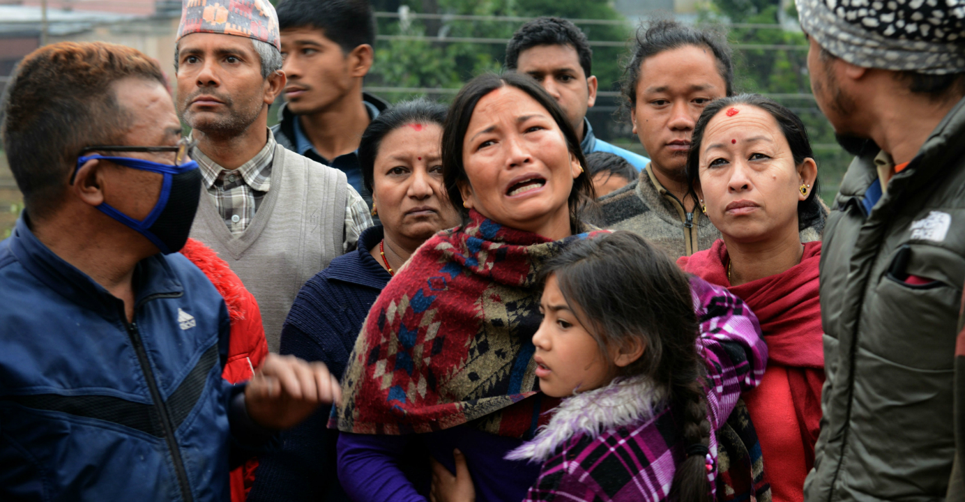 Nepalese mourn the deaths of relatives in Kathmandu on Sunday. Photo: AFP Nepalese mourn the deaths of relatives in Kathmandu on Sunday. Photo: AFP