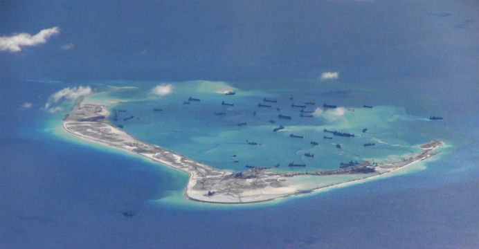 A US surveillance image appears to show Chinese dredging vessels in the waters around Mischief Reef in the disputed Spratly Islands. Photo: Reuters A US surveillance image appears to show Chinese dredging vessels in the waters around Mischief Reef in the disputed Spratly Islands. Photo: Reuters