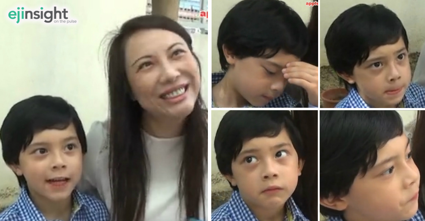 A proud mother speaks to a reporter after her son gained admission to a prestigious primary school. The boy, however, shows no visible signs of joy, in a video clip that has gone viral. Credit: Apple Daily A proud mother speaks to a reporter after her son gained admission to a prestigious primary school. The boy, however, shows no visible signs of joy, in a video clip that has gone viral. Credit: Apple Daily