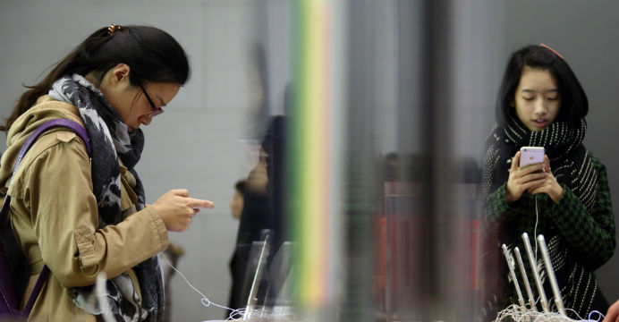 The iPhone quietly downloads huge amounts of data without the user being aware of it. Photo: Bloomberg The iPhone quietly downloads huge amounts of data without the user being aware of it. Photo: Bloomberg