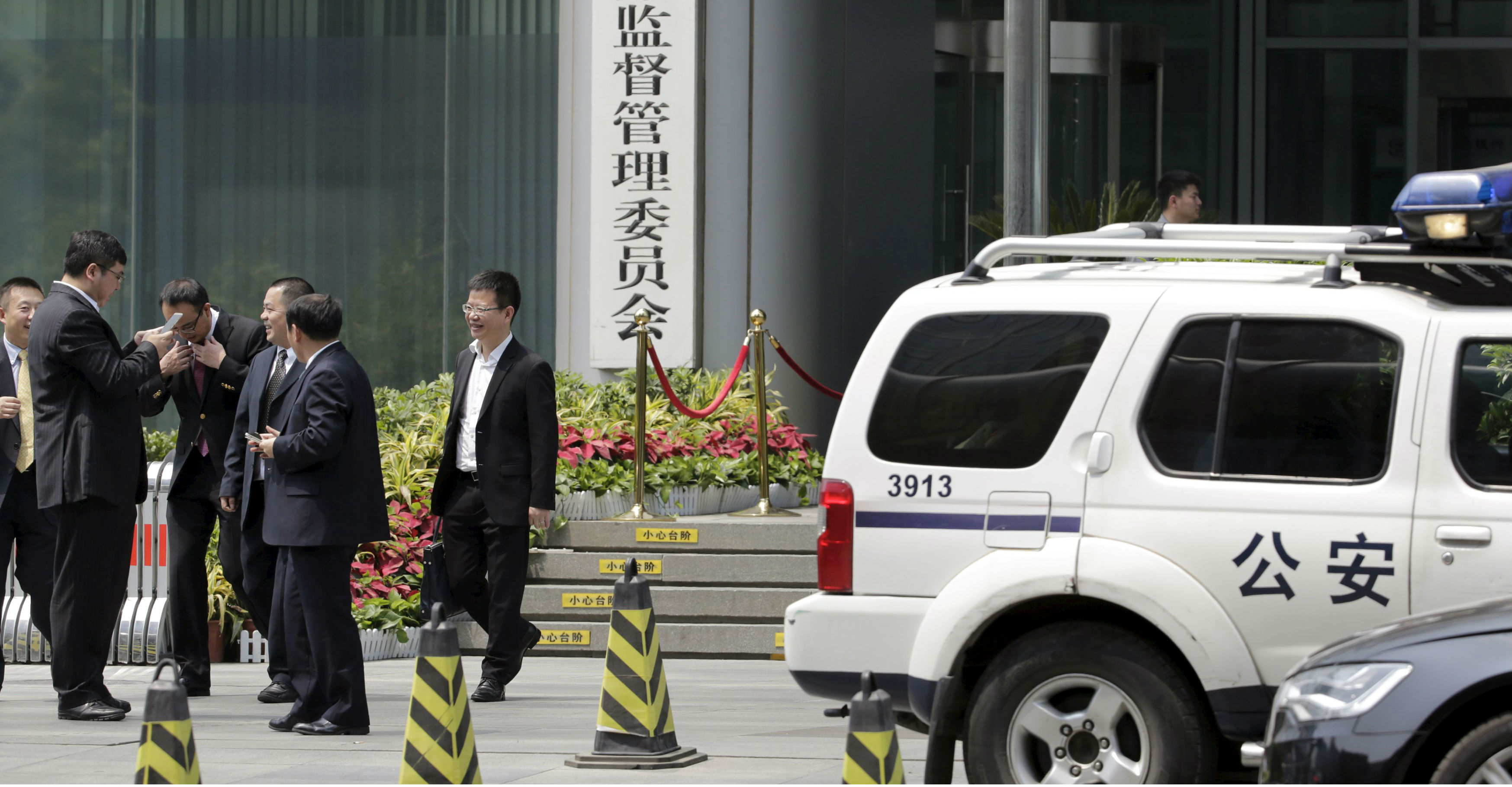 A police vehicle is seen parked outside the headquarters of the China Securities Regulatory Commission in Beijing on Thursday. The public security ministry will probe “malicious” short selling of stocks and indexes. Photo: Reuters A police vehicle is seen parked outside the headquarters of the China Securities Regulatory Commission in Beijing on Thursday. The public security ministry will probe “malicious” short selling of stocks and indexes. Photo: Reuters