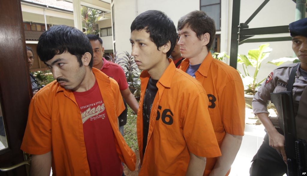 Abdulbasit Tuzer, Ahmet Mahmud and Abdullah (left to right) are escorted by police to their trial in Jakarta. They were found guilty of violating anti-terrorism and immigration laws. Photo: AP Abdulbasit Tuzer, Ahmet Mahmud and Abdullah (left to right) are escorted by police to their trial in Jakarta. They were found guilty of violating anti-terrorism and immigration laws. Photo: AP