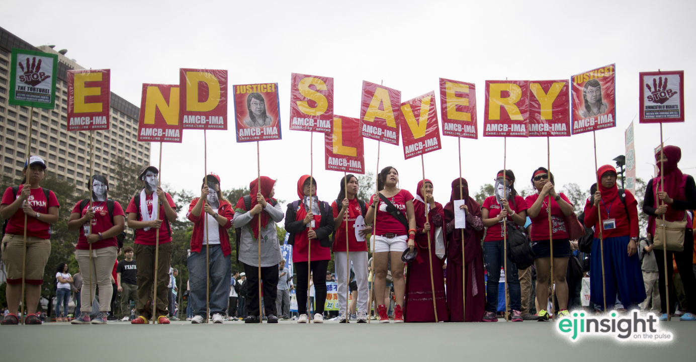 Domestic helpers hold up signs that read "End Slavery" during a Labor Day rally in Hong Kong last year. Photo: Bloomberg Domestic helpers hold up signs that read "End Slavery" during a Labor Day rally in Hong Kong last year. Photo: Bloomberg