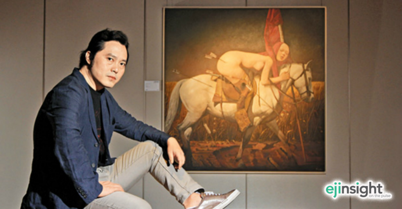 Wei Dong said he wants to bring out his melancholy and fears through the expression of primitive desires. Next to him is his work, Horseback Rider No. 1 (2009). Photo: HKEJ Wei Dong said he wants to bring out his melancholy and fears through the expression of primitive desires. Next to him is his work, Horseback Rider No. 1 (2009). Photo: HKEJ