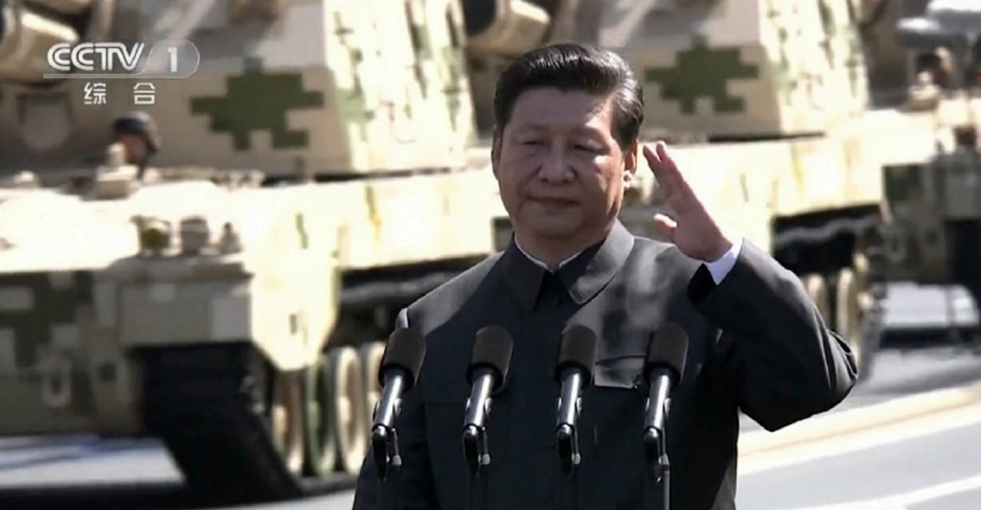 Is President Xi Jinping waving or saluting? Opinions on this are divided. Photo: CCTV Is President Xi Jinping waving or saluting? Opinions on this are divided. Photo: CCTV