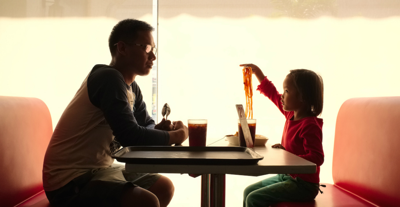 Dennis and his daughter Dennis-Ann eat lunch at the local Jollybee fast food restaurant in Tarlac, Philippines. Dennis and his daughter Dennis-Ann eat lunch at the local Jollybee fast food restaurant in Tarlac, Philippines.