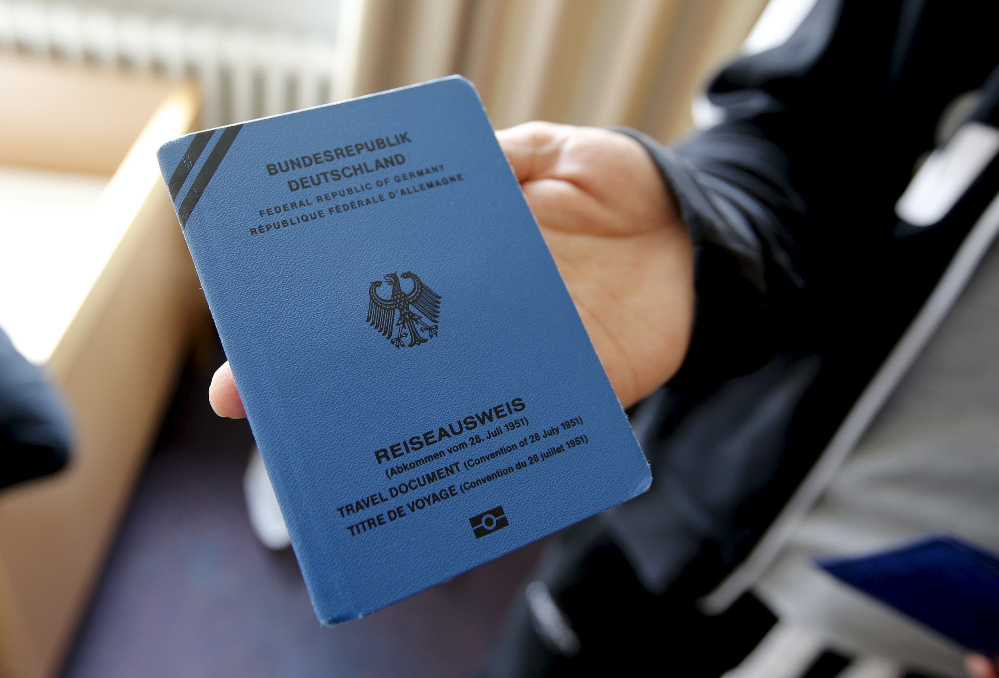 A Syrian asylum seeker displays his refugee travel document issued by the German authorities. Europe has had an uneven response to the refugee crisis. Photo: Reuters A Syrian asylum seeker displays his refugee travel document issued by the German authorities. Europe has had an uneven response to the refugee crisis. Photo: Reuters