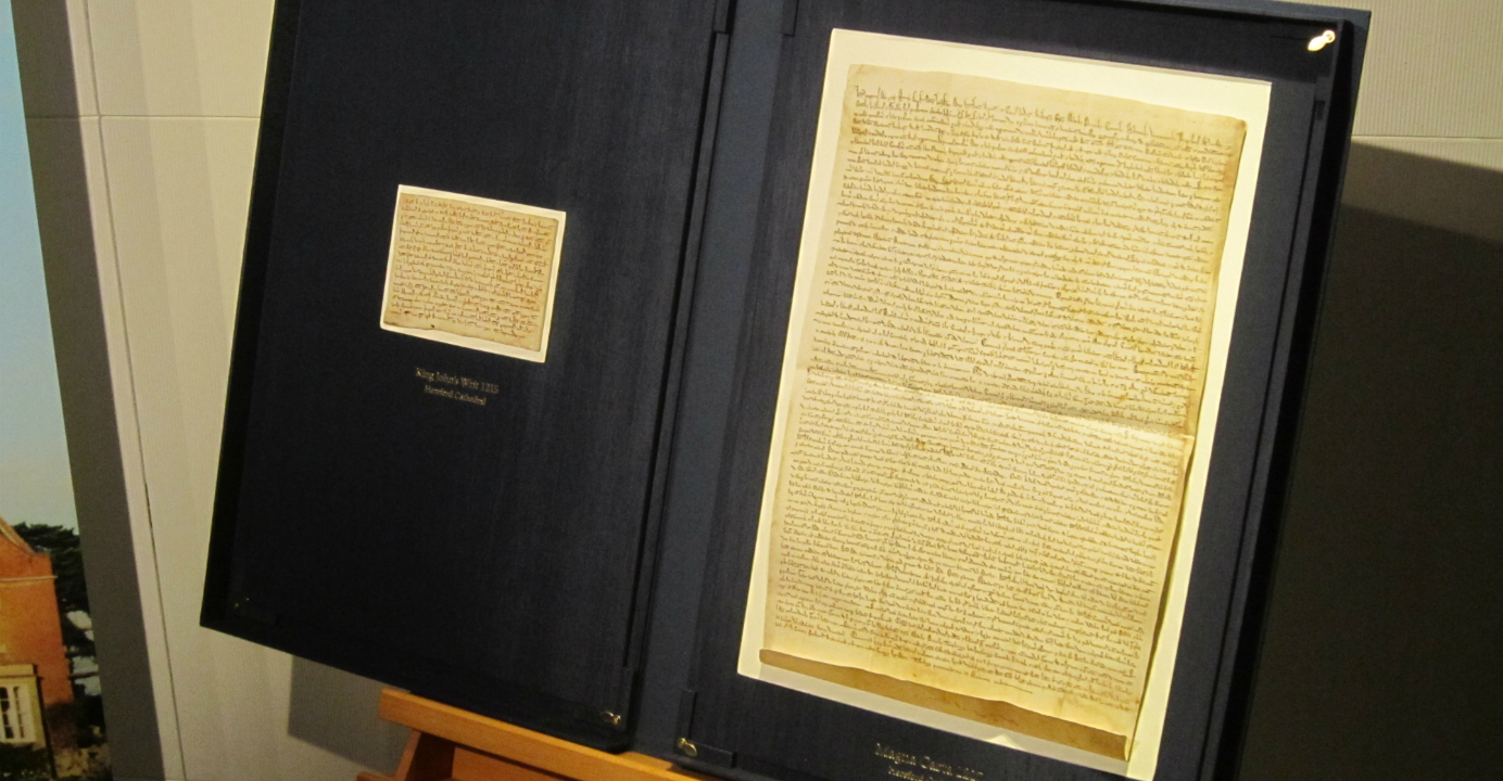The Magna Carta is displayed alongside the only surviving copy of the King's Writ, a letter sent by King John in 1215 to royal officials in each English county announcing the terms of the Magna Carta. Photo: EJ Insight The Magna Carta is displayed alongside the only surviving copy of the King's Writ, a letter sent by King John in 1215 to royal officials in each English county announcing the terms of the Magna Carta. Photo: EJ Insight