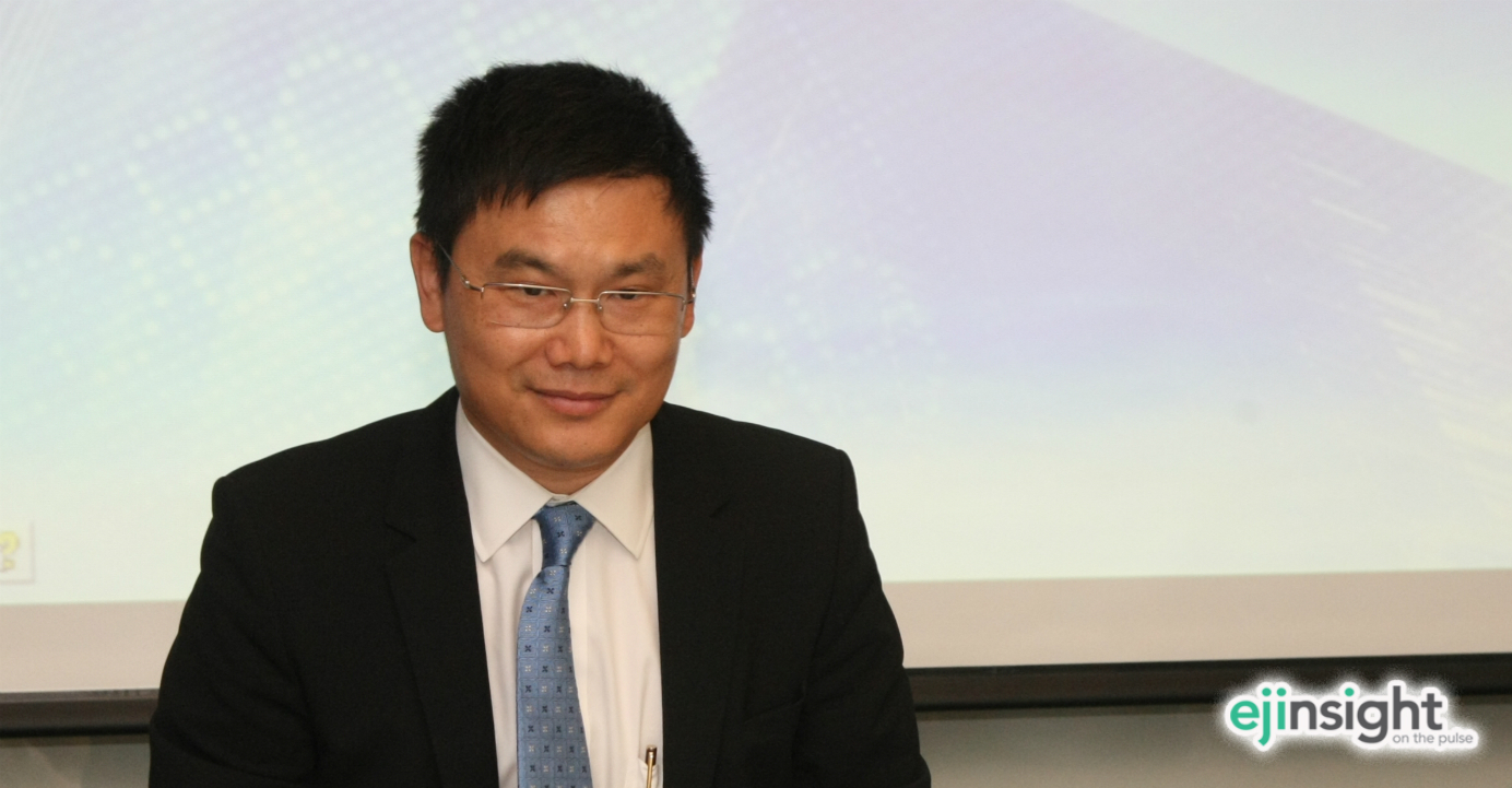 Yan Feng has resumed his duties at Guotai Junan after assisting authorities in probes unrelated to himself or the company. Photo: HKEJ Yan Feng has resumed his duties at Guotai Junan after assisting authorities in probes unrelated to himself or the company. Photo: HKEJ