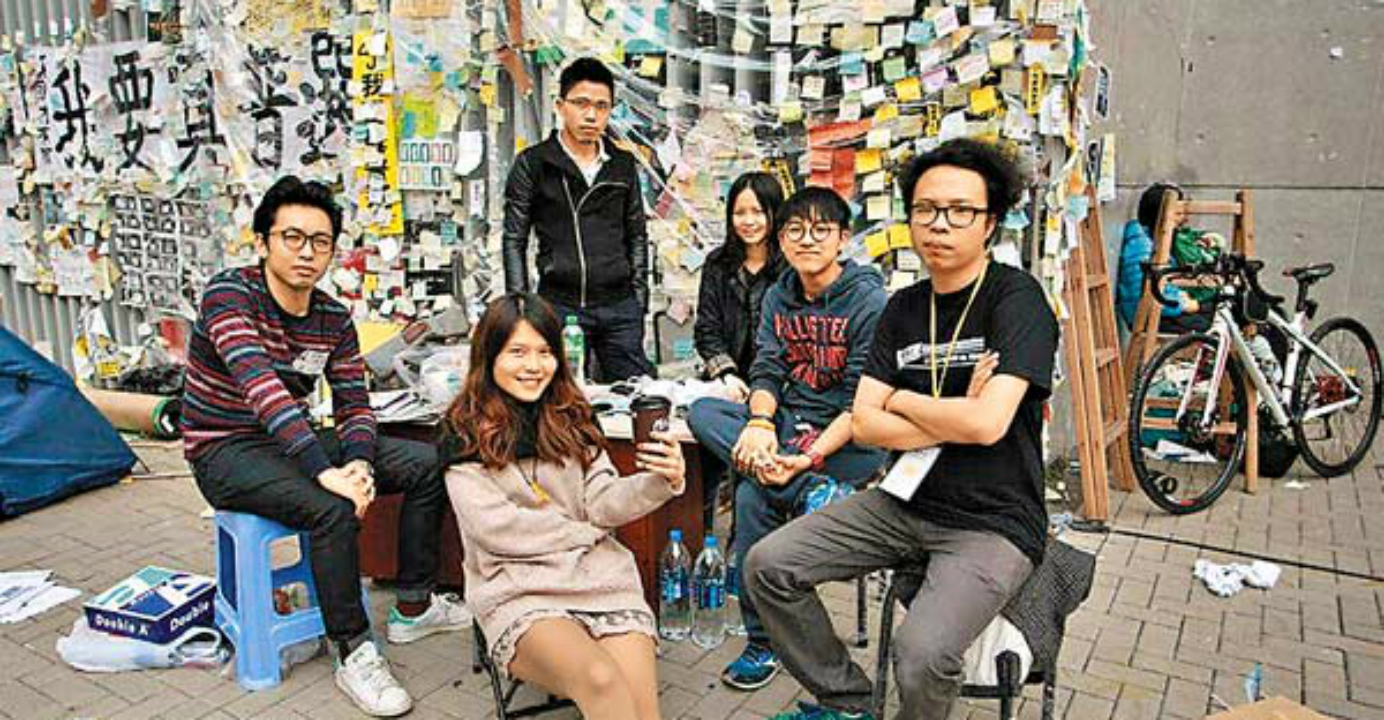 Yeung (center) and like-minded friends formed the Umbrella Movement Visual Archive and Research Collective to preserve artworks from the pro-democracy campaign for history. Photo: HKEJ Yeung (center) and like-minded friends formed the Umbrella Movement Visual Archive and Research Collective to preserve artworks from the pro-democracy campaign for history. Photo: HKEJ