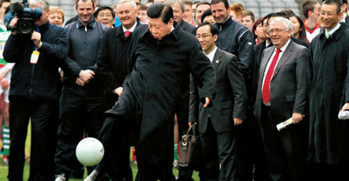 This photo of Xi Jinping kicking a ball on a visit to Ireland has been seen in his office in Beijing. Photo: Xinhua This photo of Xi Jinping kicking a ball on a visit to Ireland has been seen in his office in Beijing. Photo: Xinhua