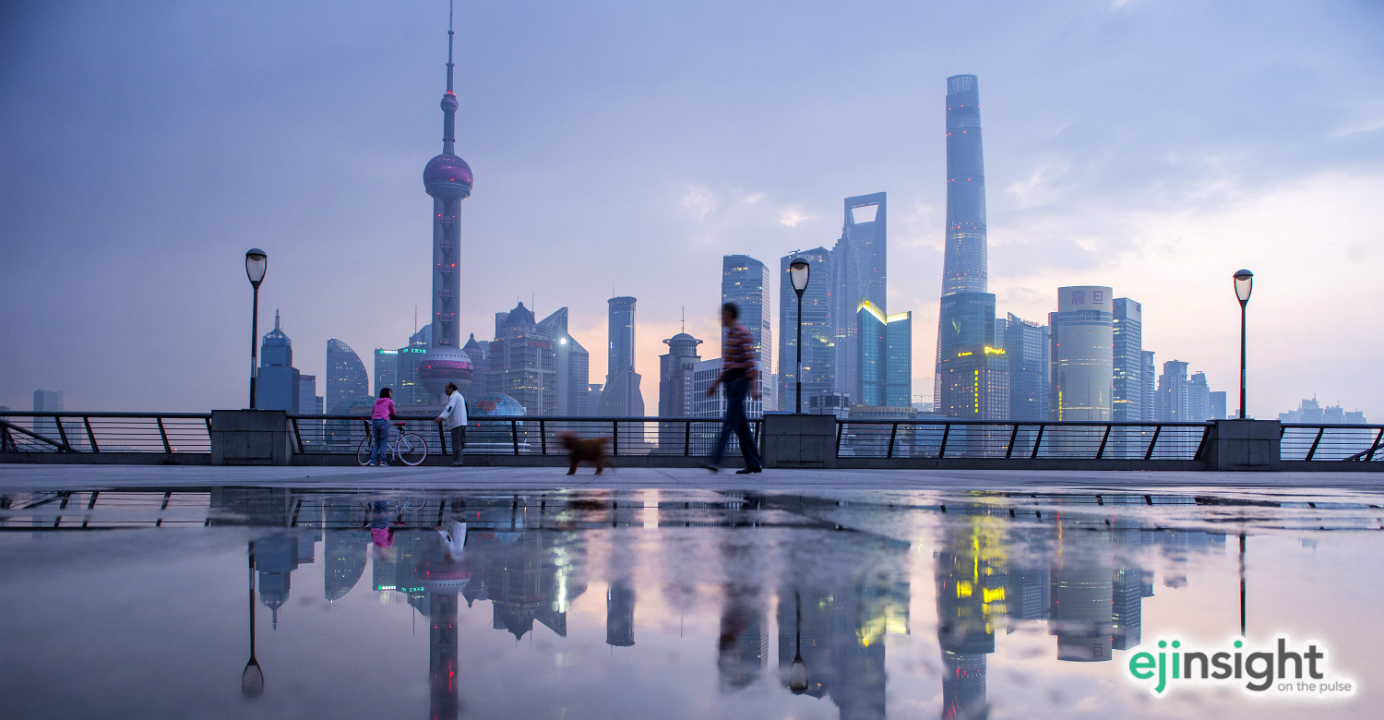 Skyscrapers and people are reflected in a puddle of water in the early morning in the Bund in Shanghai. Chinese companies are resorting to dealmaking to ride out a slowing economy. Photo: Xinhua Skyscrapers and people are reflected in a puddle of water in the early morning in the Bund in Shanghai. Chinese companies are resorting to dealmaking to ride out a slowing economy. Photo: Xinhua