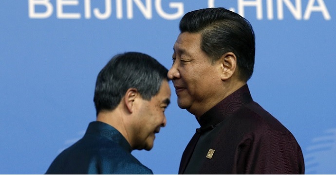 A file photo shows Leung Chun-ying (left) walk past President Xi Jinping at a forum. Xi is looking to absolve himself of the blame amid Hongkongers' growing estrangement from China. Photo: Reuters A file photo shows Leung Chun-ying (left) walk past President Xi Jinping at a forum. Xi is looking to absolve himself of the blame amid Hongkongers' growing estrangement from China. Photo: Reuters