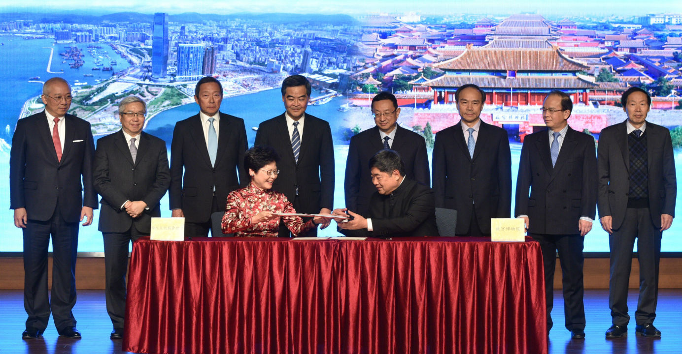 Chief Secretary Carrie Lam (seated, left) and Palace Museum director Dr. Shan Jixiang (seated, right) with other officials at a ceremony marking the Hong Kong Palace Museum deal in Beijing on Dec. 23. Photo: GovHK Chief Secretary Carrie Lam (seated, left) and Palace Museum director Dr. Shan Jixiang (seated, right) with other officials at a ceremony marking the Hong Kong Palace Museum deal in Beijing on Dec. 23. Photo: GovHK