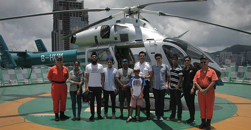 Move4Migrants participants join a helicopter tour of Hong Kong organized by actor-pilot Micheal Wong. Photo: Move4Migrants Move4Migrants participants join a helicopter tour of Hong Kong organized by actor-pilot Micheal Wong. Photo: Move4Migrants