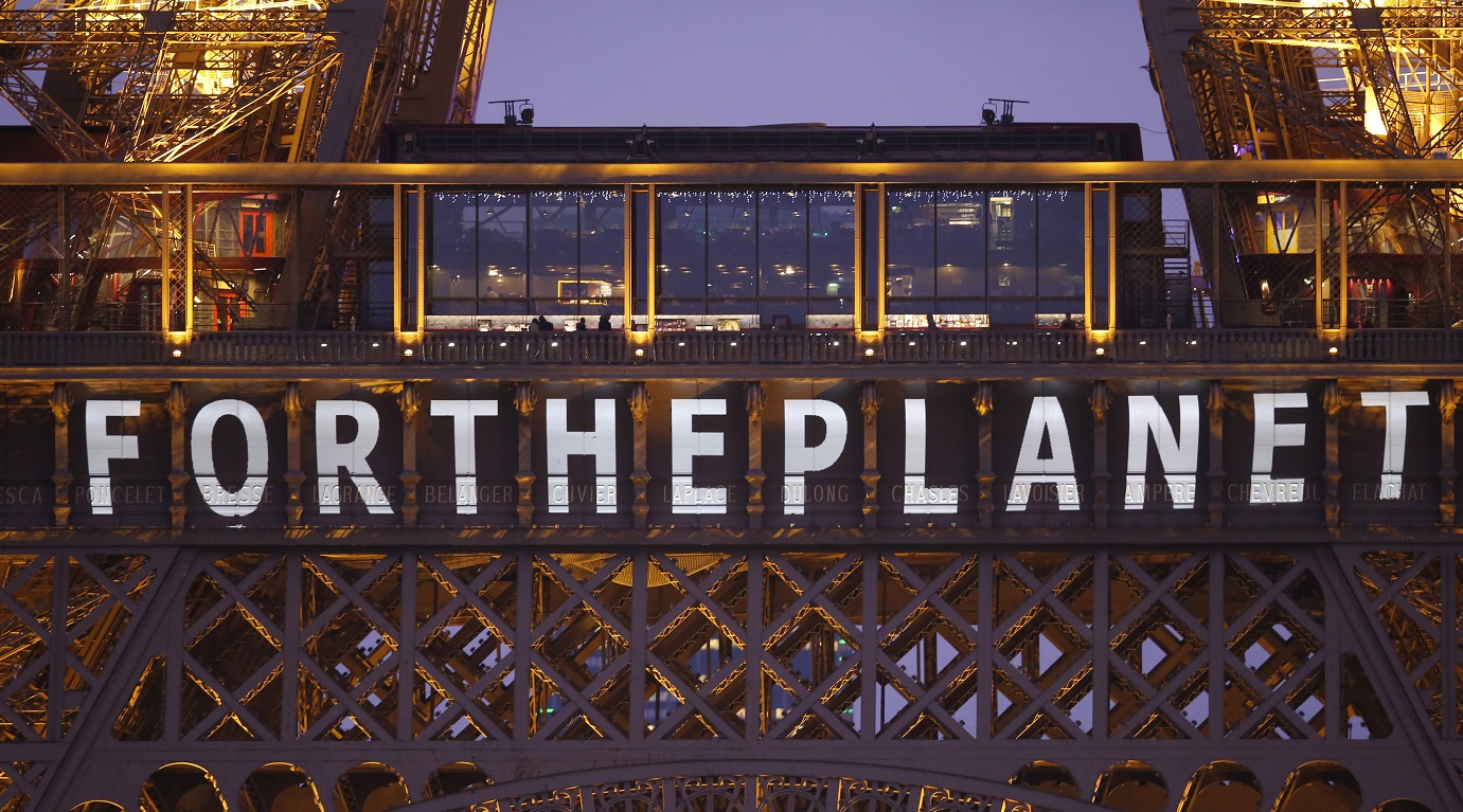 The slogan "For the planet" is projected on the Eiffel Tower. The Paris climate agreement was signed by 193 countries to cooperate in decarbonizing the world’s energy system. Photo: Reuters The slogan "For the planet" is projected on the Eiffel Tower. The Paris climate agreement was signed by 193 countries to cooperate in decarbonizing the world’s energy system. Photo: Reuters