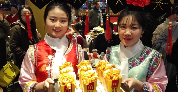 McDonald's waitresses don traditional Qing dynasty imperial costumes to serve fries to diners in a restaurant in China. Photo: CNSA McDonald's waitresses don traditional Qing dynasty imperial costumes to serve fries to diners in a restaurant in China. Photo: CNSA