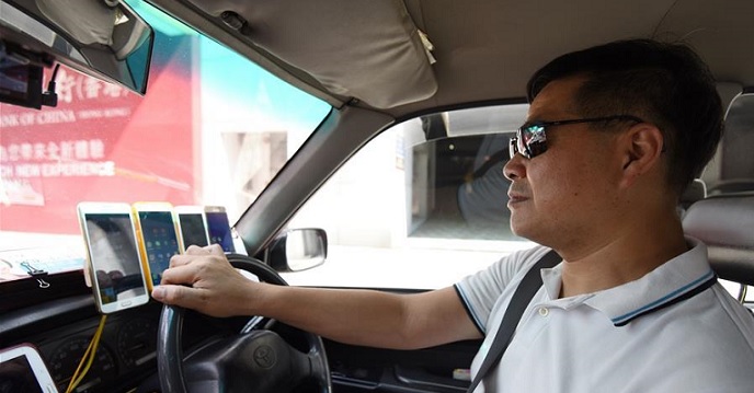 Many newcomers to Hong Kong may be amazed by the many phones a cabbie puts on his dashboard. Photo: Xinhua Many newcomers to Hong Kong may be amazed by the many phones a cabbie puts on his dashboard. Photo: Xinhua