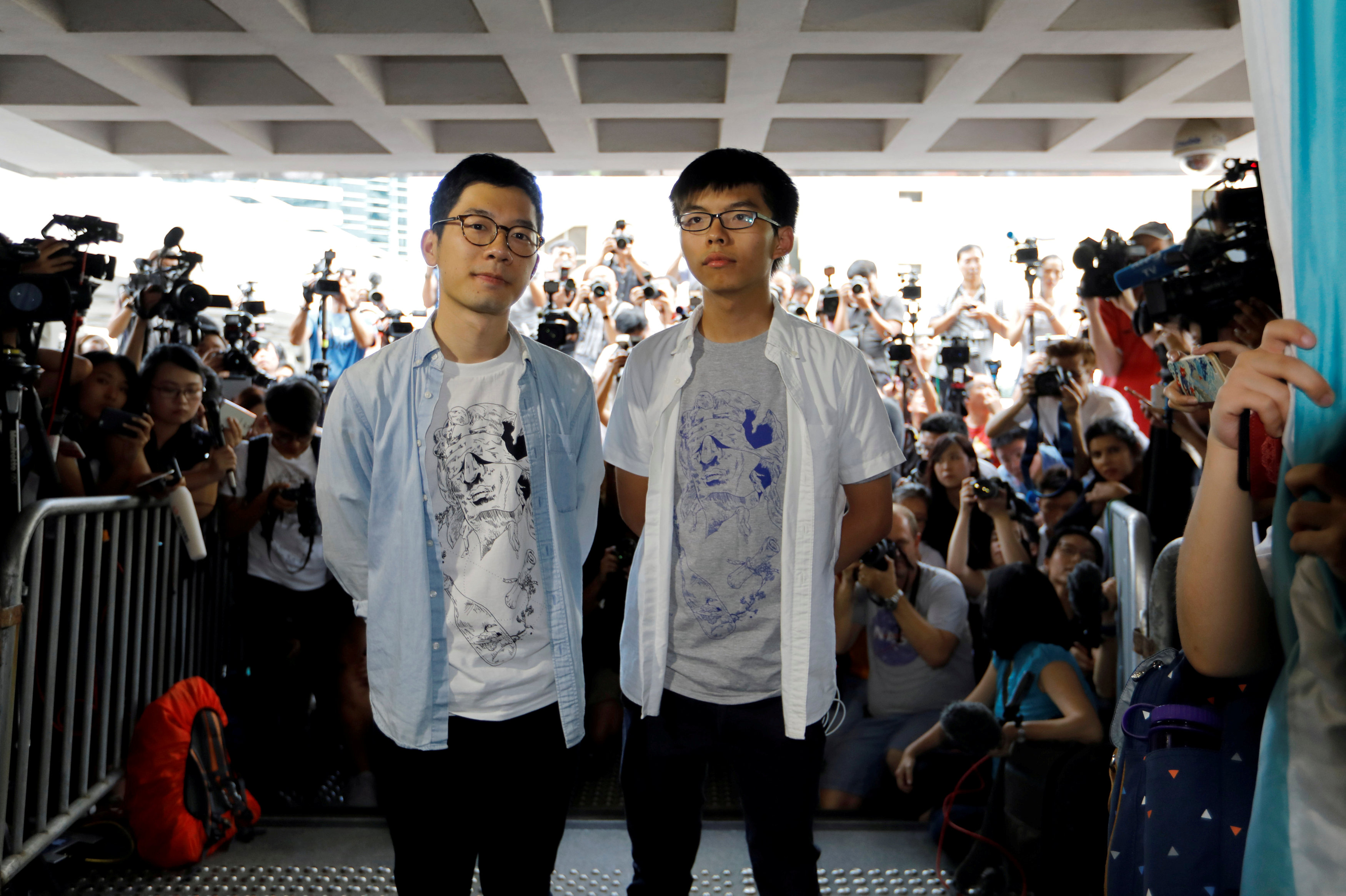 A file picture shows Nathan Law and Joshua Wong arriving at a court on Aug. 17 to face verdict on charges relating to a 2014 protest. The two student leaders were among those sentenced to jail, sparking angry reactions among the opposition. Photo: Reuters A file picture shows Nathan Law and Joshua Wong arriving at a court on Aug. 17 to face verdict on charges relating to a 2014 protest. The two student leaders were among those sentenced to jail, sparking angry reactions among the opposition. Photo: Reuters