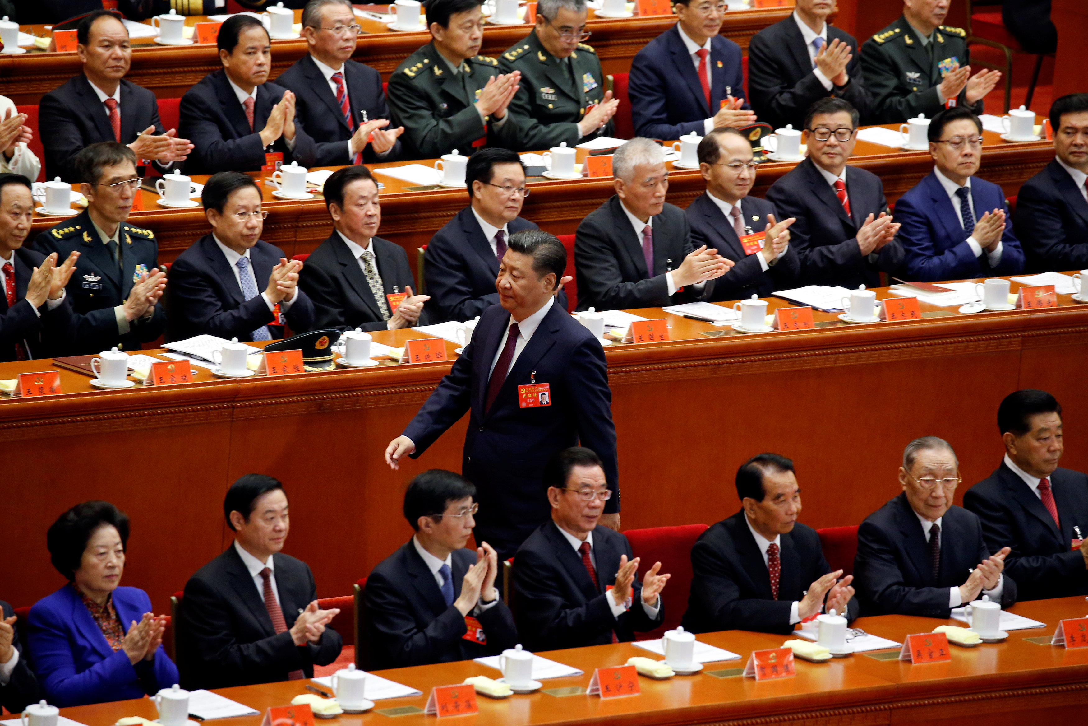 Xi Jinping walks towards the stand to deliver his speech during the opening session of the Chinese Communist Party’s 19th National Congress in Beijing on Wednesday. Investors will be watching the event closely for clues on policy initiatives for the next Xi Jinping walks towards the stand to deliver his speech during the opening session of the Chinese Communist Party’s 19th National Congress in Beijing on Wednesday. Investors will be watching the event closely for clues on policy initiatives for the next