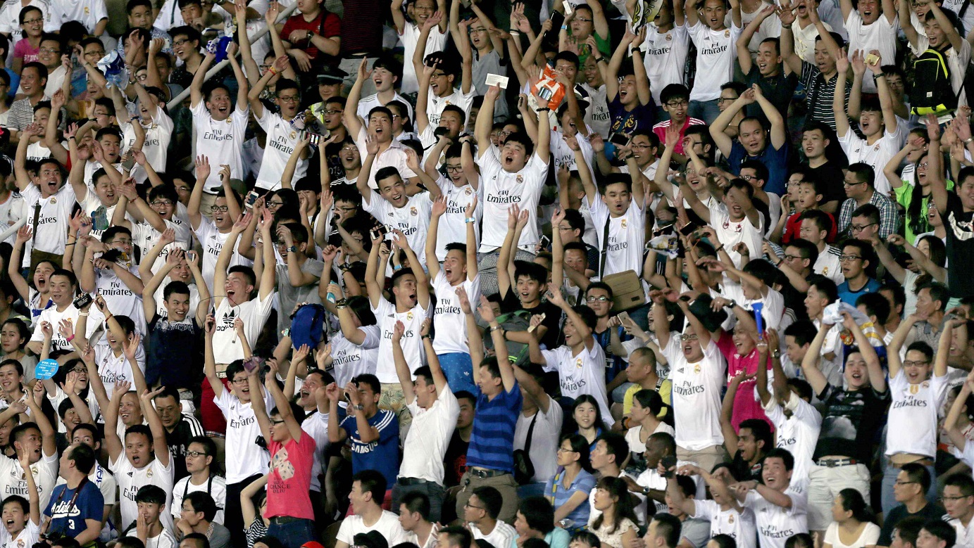 Chinese fans cheer Real Madrid in a friendly match in Guangzhou. The European champion is popular in China. Photo: Reuters Chinese fans cheer Real Madrid in a friendly match in Guangzhou. The European champion is popular in China. Photo: Reuters