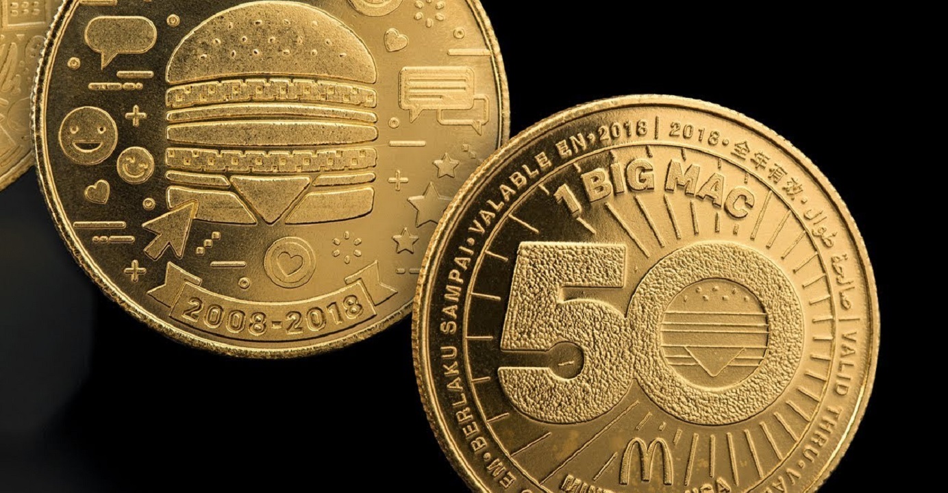 The front side of a MacCoin features graphic and text on the 50th anniversary of the Big Mac in multiple languages, while the back side is available in five designs, each representing a decade of the Big Mac. Photo: Internet The front side of a MacCoin features graphic and text on the 50th anniversary of the Big Mac in multiple languages, while the back side is available in five designs, each representing a decade of the Big Mac. Photo: Internet