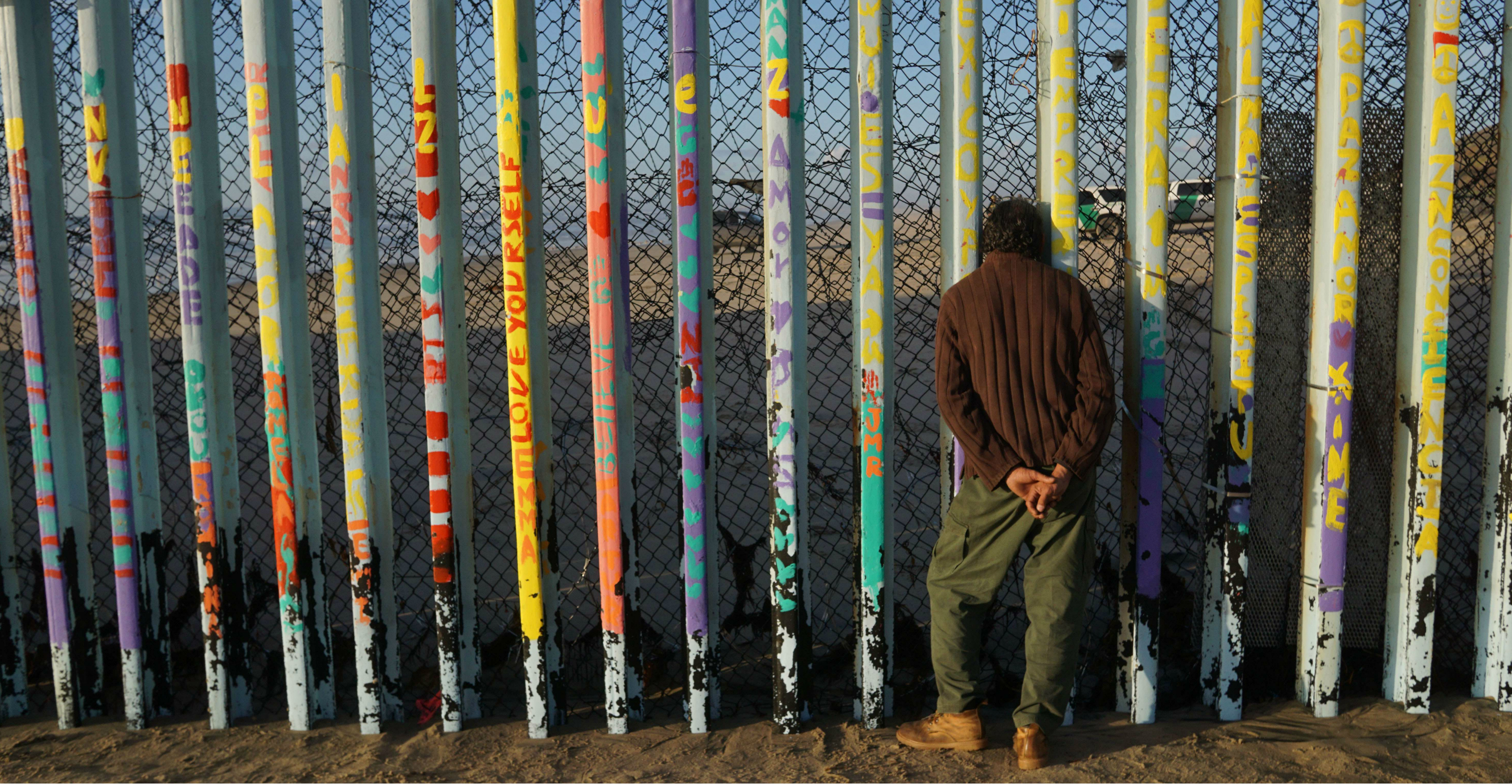 A man looks through the US-Mexico border wall in the Las Playas area in Tijuana, Mexico. US congressional aides said the new tentative deal does not contain the US$5.7 billion President Donald Trump wants for a border wall. Photo: AFP A man looks through the US-Mexico border wall in the Las Playas area in Tijuana, Mexico. US congressional aides said the new tentative deal does not contain the US$5.7 billion President Donald Trump wants for a border wall. Photo: AFP