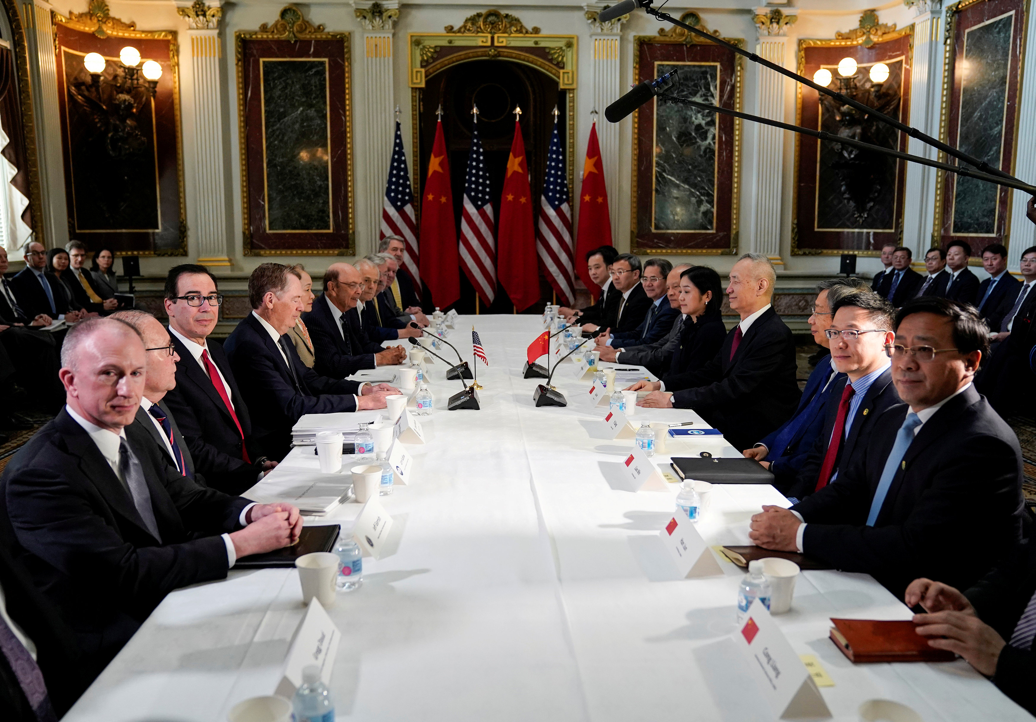 Top US and Chinese officials sit across each other ahead of the start of trade talks in Washington on Feb. 21. Photo: Reuters Top US and Chinese officials sit across each other ahead of the start of trade talks in Washington on Feb. 21. Photo: Reuters
