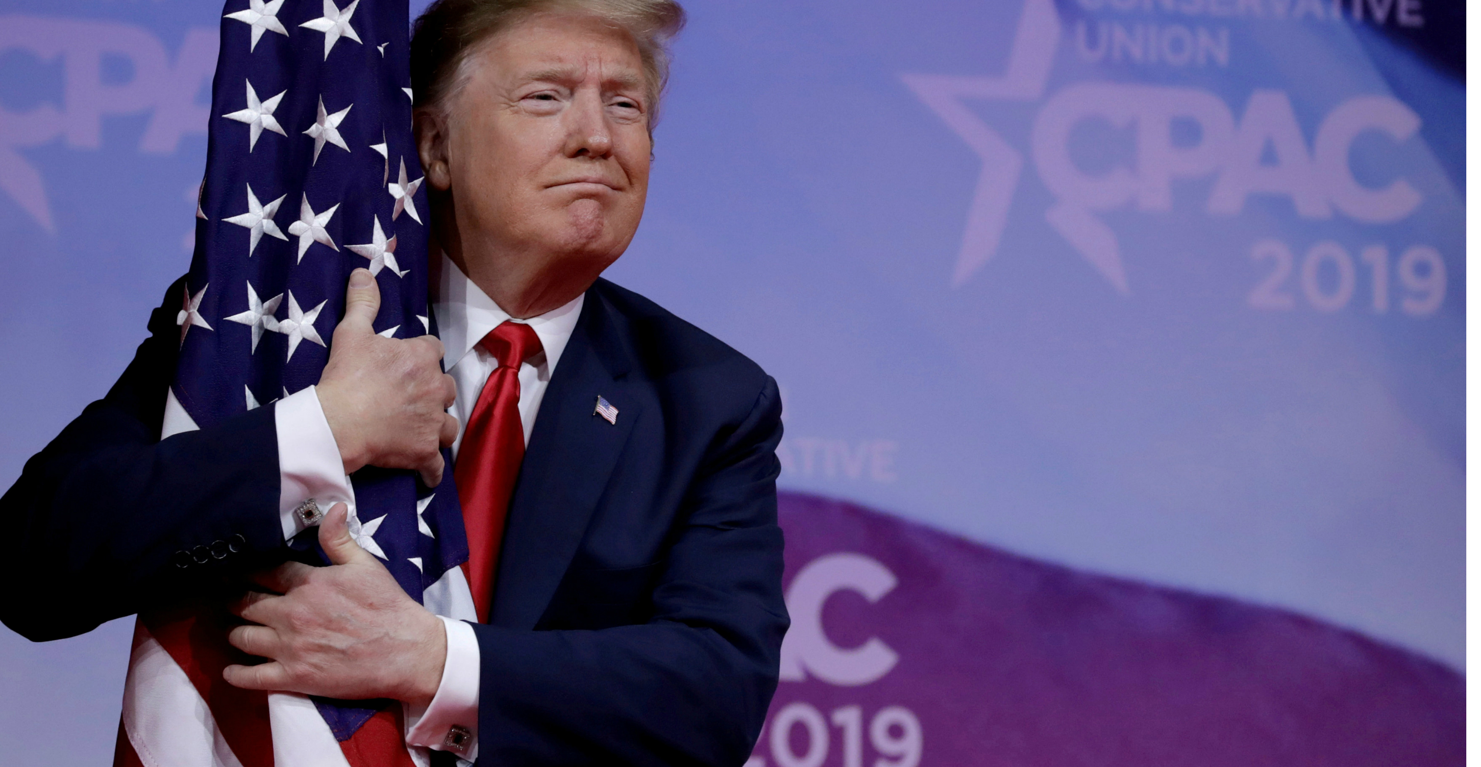 US President Donald Trump hugs the American flag at the Conservative Political Action Conference annual meeting at National Harbor near Washington on Saturday. Photo: Reuters US President Donald Trump hugs the American flag at the Conservative Political Action Conference annual meeting at National Harbor near Washington on Saturday. Photo: Reuters
