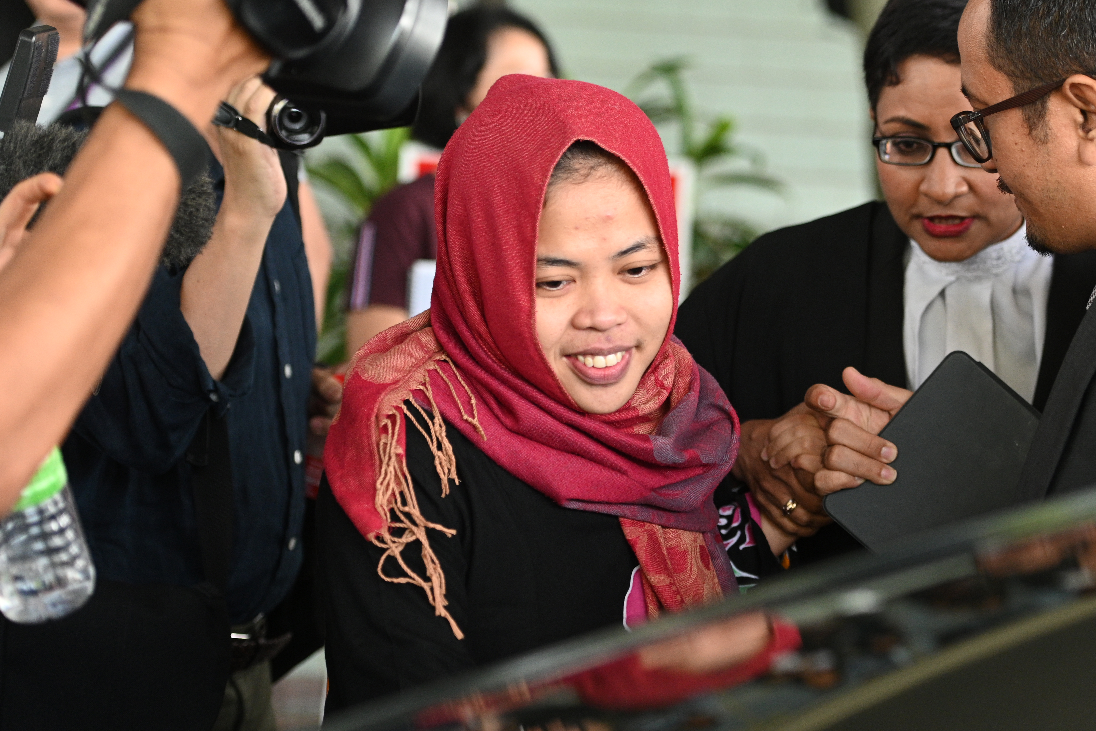 Indonesian national Siti Aisyah smiles while leaving the Shah Alam High Court outside Kuala Lumpur on Monday. Photo: AFP Indonesian national Siti Aisyah smiles while leaving the Shah Alam High Court outside Kuala Lumpur on Monday. Photo: AFP