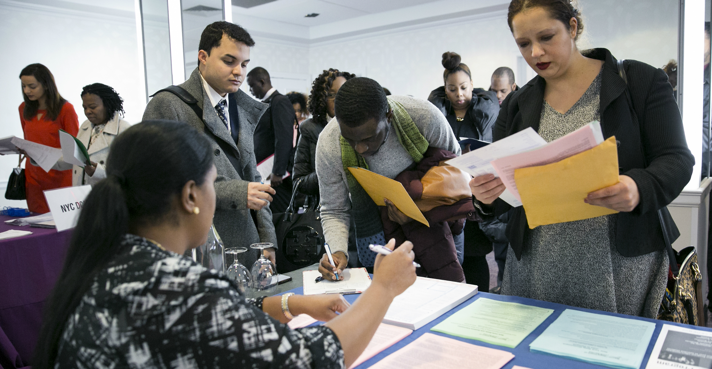 Jobseekers fill out forms at a jobs fair in New York. The old economic theory that asserts a clear tradeoff between unemployment and inflation does not hold true in the US and Britain after the global financial crisis. Photo: Bloomberg Jobseekers fill out forms at a jobs fair in New York. The old economic theory that asserts a clear tradeoff between unemployment and inflation does not hold true in the US and Britain after the global financial crisis. Photo: Bloomberg
