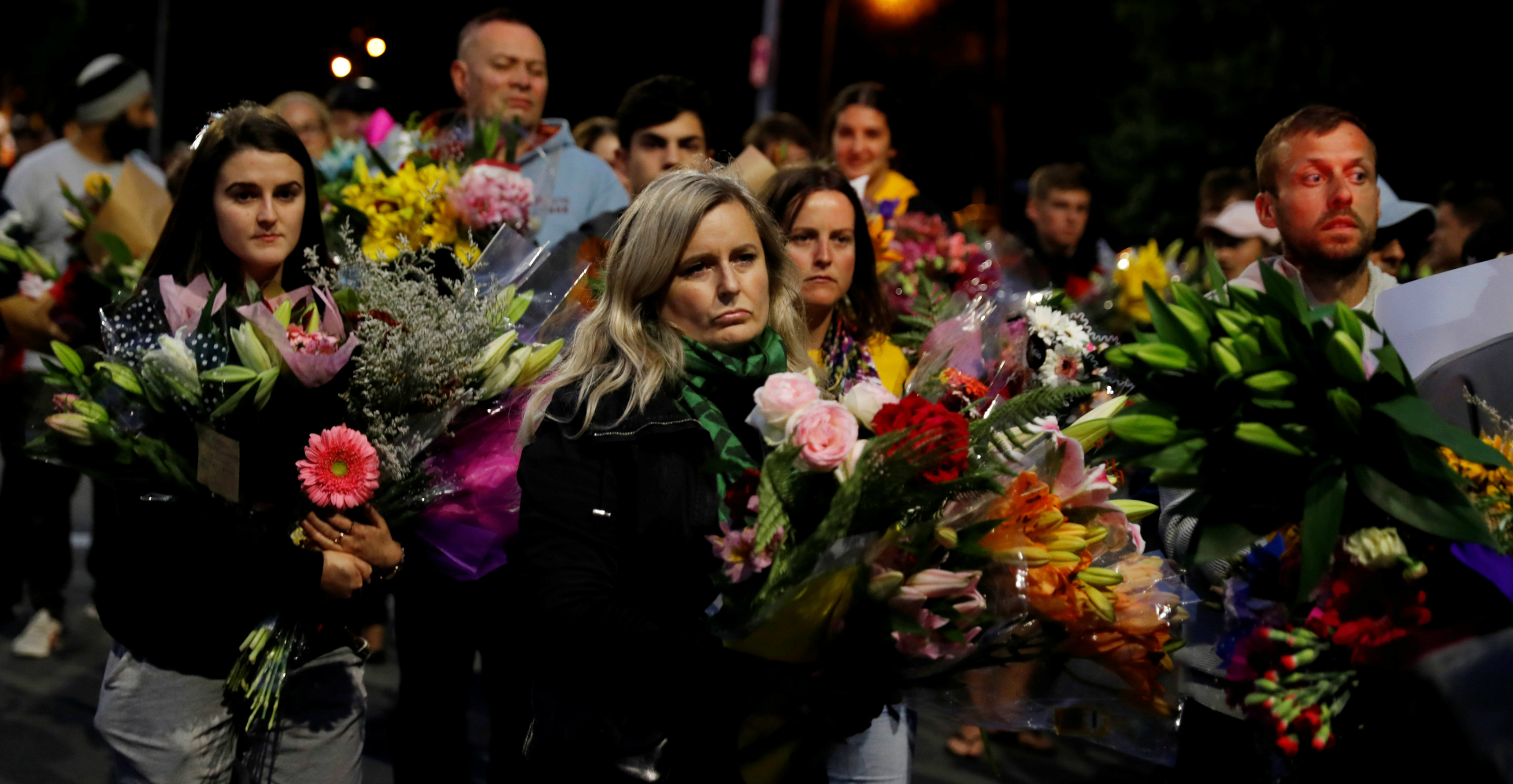 People offer flowers outside Masjid Al Noor in Christchurch on Saturday. Photo: Reuters People offer flowers outside Masjid Al Noor in Christchurch on Saturday. Photo: Reuters