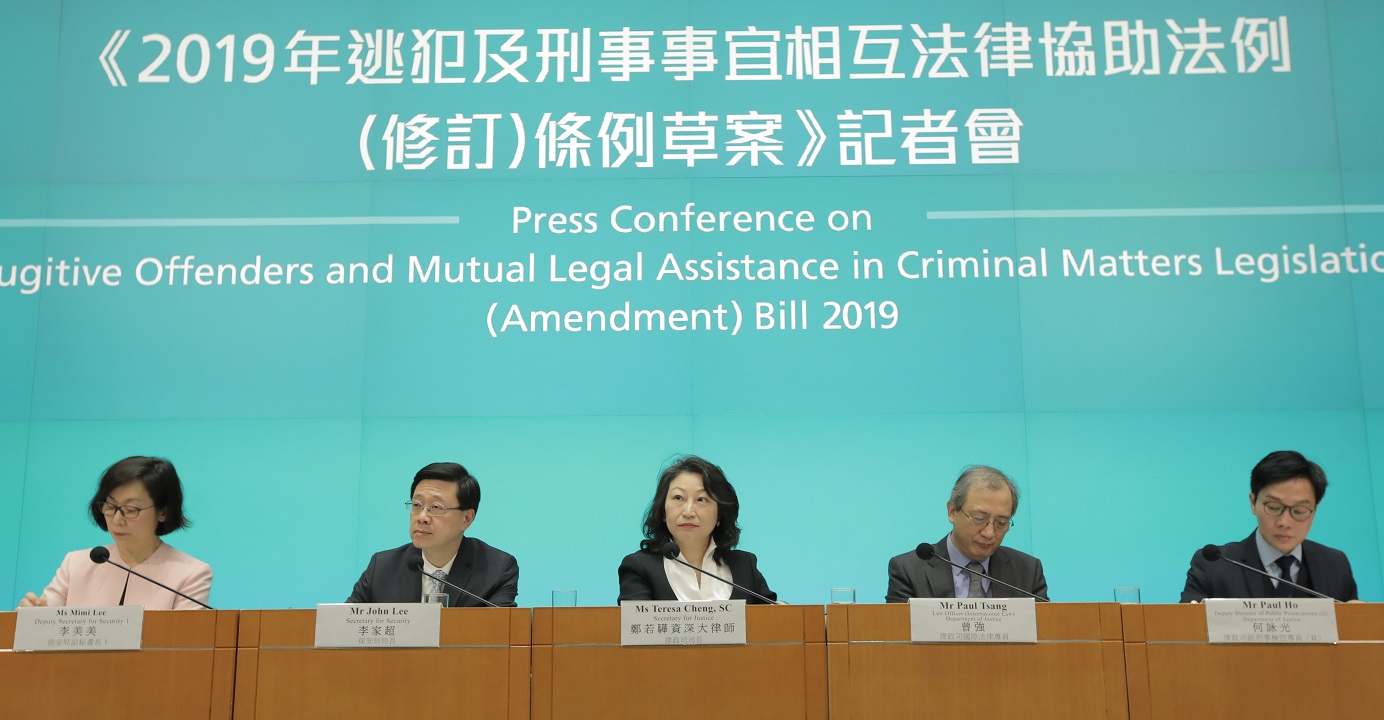 Secretary for Justice Teresa Cheng (center) and Secretary for Security John Lee (2nd left) defend the government's legislative proposal to amend the fugitives law during a press conference on Tuesday. Photo: HKEJ Secretary for Justice Teresa Cheng (center) and Secretary for Security John Lee (2nd left) defend the government's legislative proposal to amend the fugitives law during a press conference on Tuesday. Photo: HKEJ