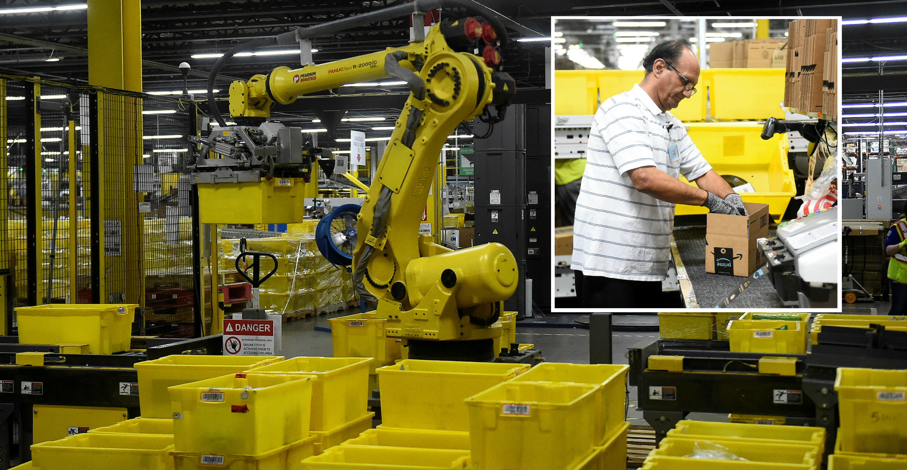 A robotic arm picks up sorting containers while a packing worker (inset) fills a delivery box with products at an Amazon fulfillment center in Baltimore, Maryland. Photo: Reuters A robotic arm picks up sorting containers while a packing worker (inset) fills a delivery box with products at an Amazon fulfillment center in Baltimore, Maryland. Photo: Reuters