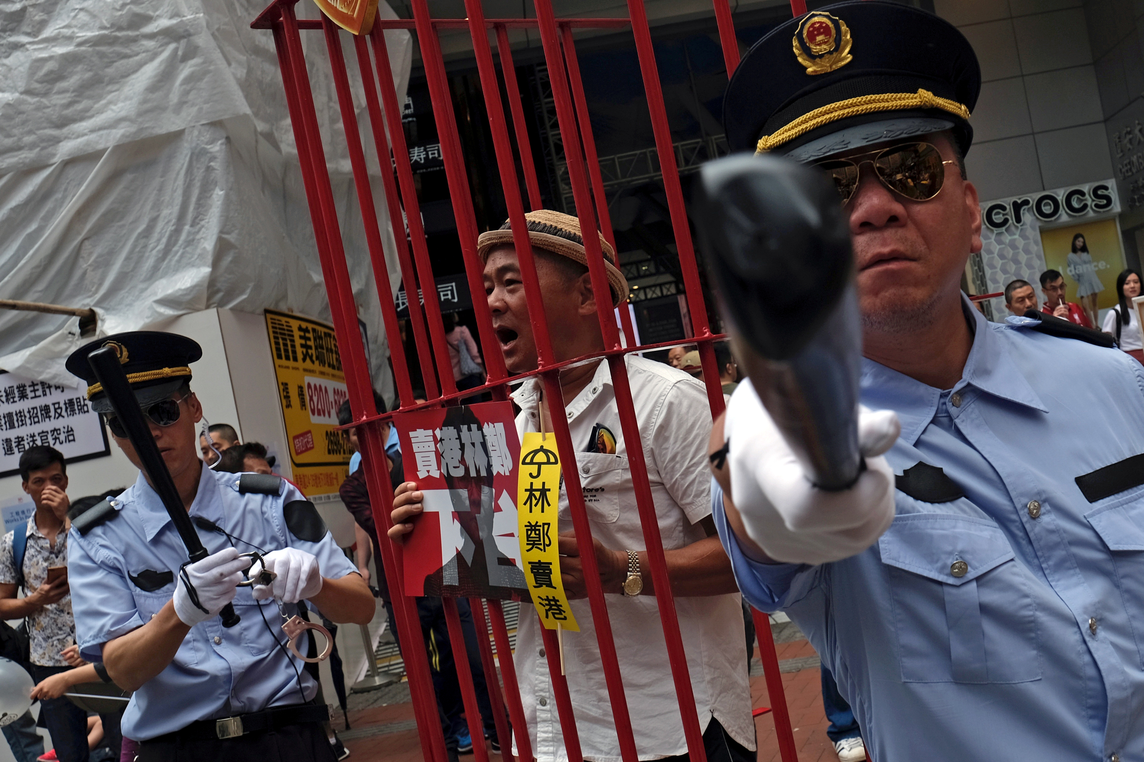 Protesters dress as Chinese police during a demonstration in Hong Kong on April 28 against the government’s proposed changes to the extradition law. Photo: Reuters Protesters dress as Chinese police during a demonstration in Hong Kong on April 28 against the government’s proposed changes to the extradition law. Photo: Reuters