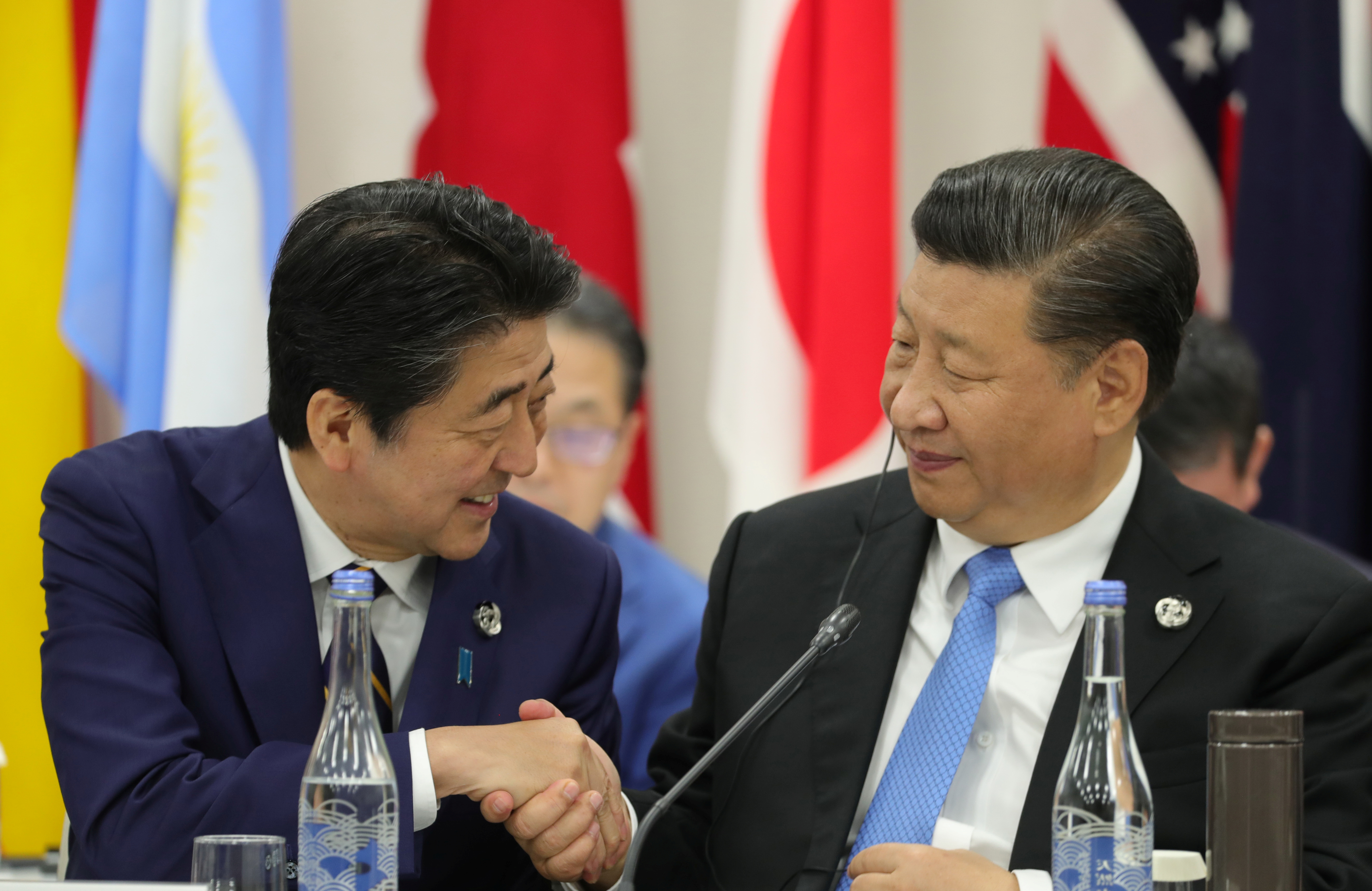 Japan's Prime Minister Shinzo Abe shakes hands with China’s President Xi Jinping during the G20 summit in Osaka, Japan on June 28. Photo: Sputnik News via Reuters Japan's Prime Minister Shinzo Abe shakes hands with China’s President Xi Jinping during the G20 summit in Osaka, Japan on June 28. Photo: Sputnik News via Reuters