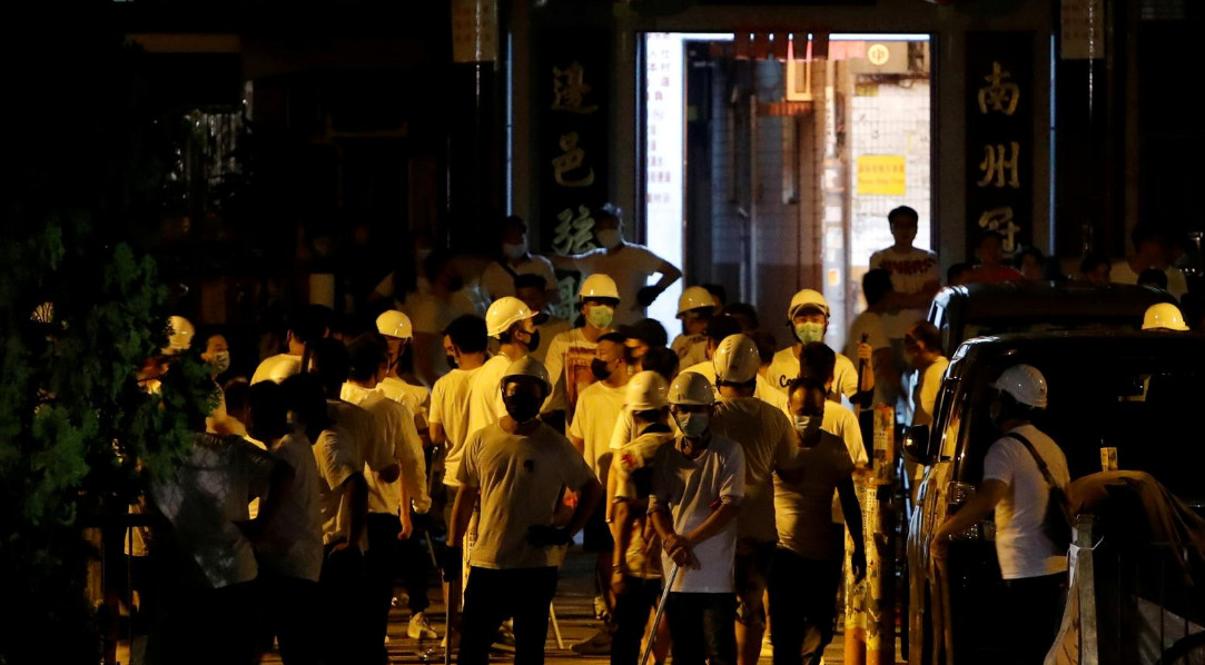White-clad gangsters sow terror at the MTR station in Yuen Long on Sunday night. Photo: Reuters White-clad gangsters sow terror at the MTR station in Yuen Long on Sunday night. Photo: Reuters