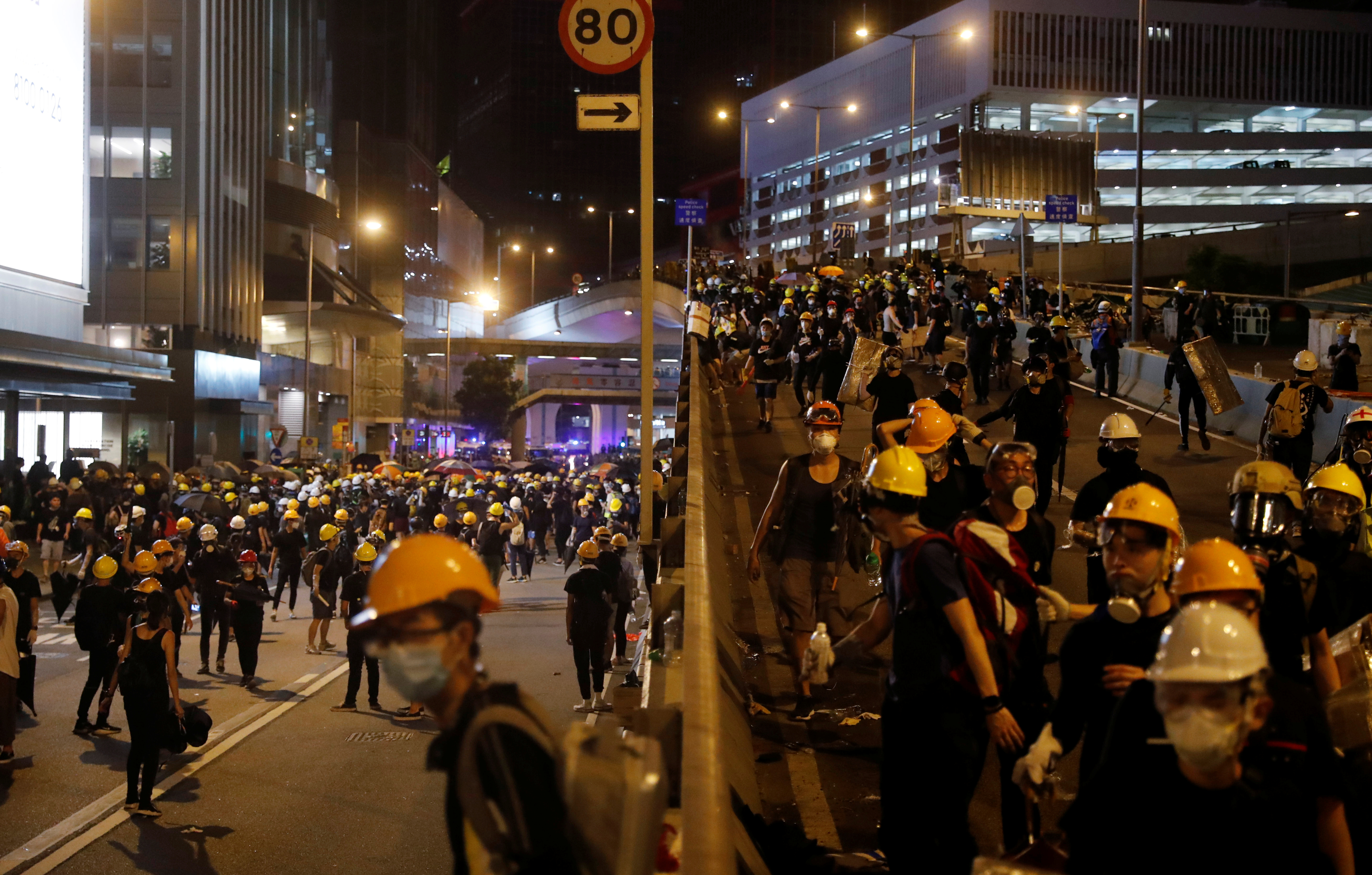 Demonstrators in Hong Kong occupy a road in Central district near China's Liaison Office during a protest on Sunday against police violence during previous marches. Photo: Reuters Demonstrators in Hong Kong occupy a road in Central district near China's Liaison Office during a protest on Sunday against police violence during previous marches. Photo: Reuters