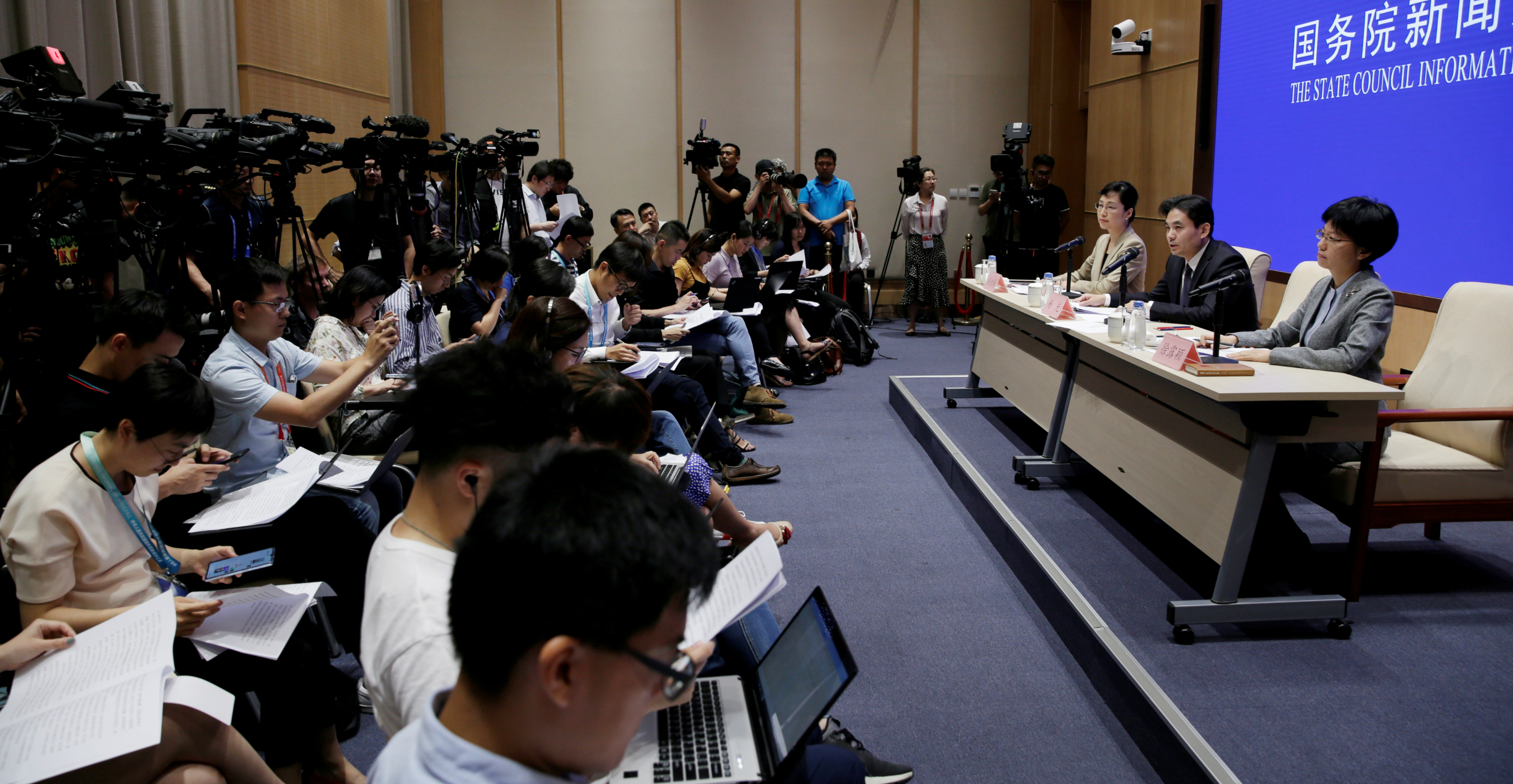 Yang Guang (center) and Xu Luying (right) of the Hong Kong and Macau Affairs Office of the State Council attend a news conference on the current situation in Hong Kong, in Beijing on Tuesday. Photo: Reuters Yang Guang (center) and Xu Luying (right) of the Hong Kong and Macau Affairs Office of the State Council attend a news conference on the current situation in Hong Kong, in Beijing on Tuesday. Photo: Reuters