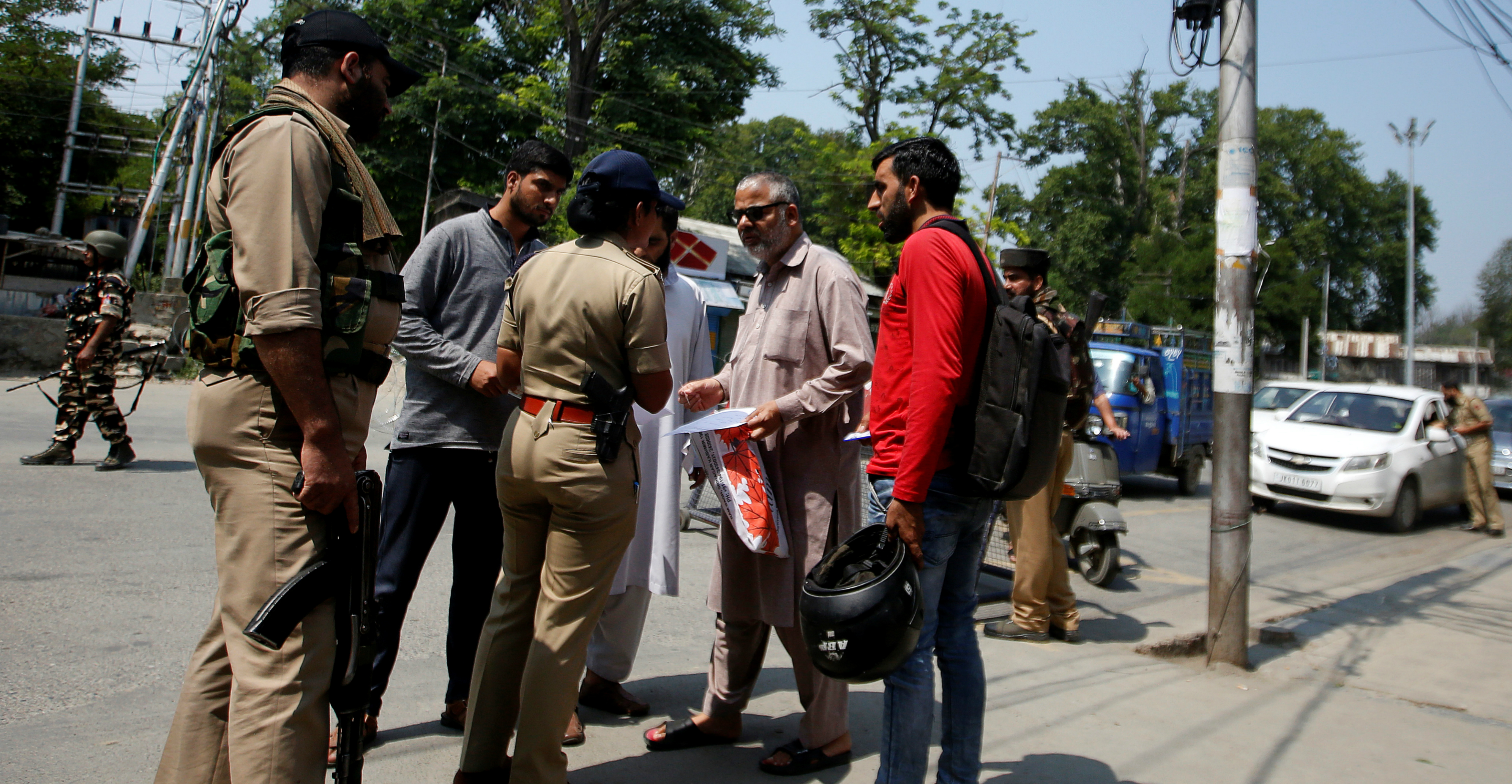 An Indian police officer checks papers of residents in Srinagar on Tuesday. Photo: Reuters An Indian police officer checks papers of residents in Srinagar on Tuesday. Photo: Reuters